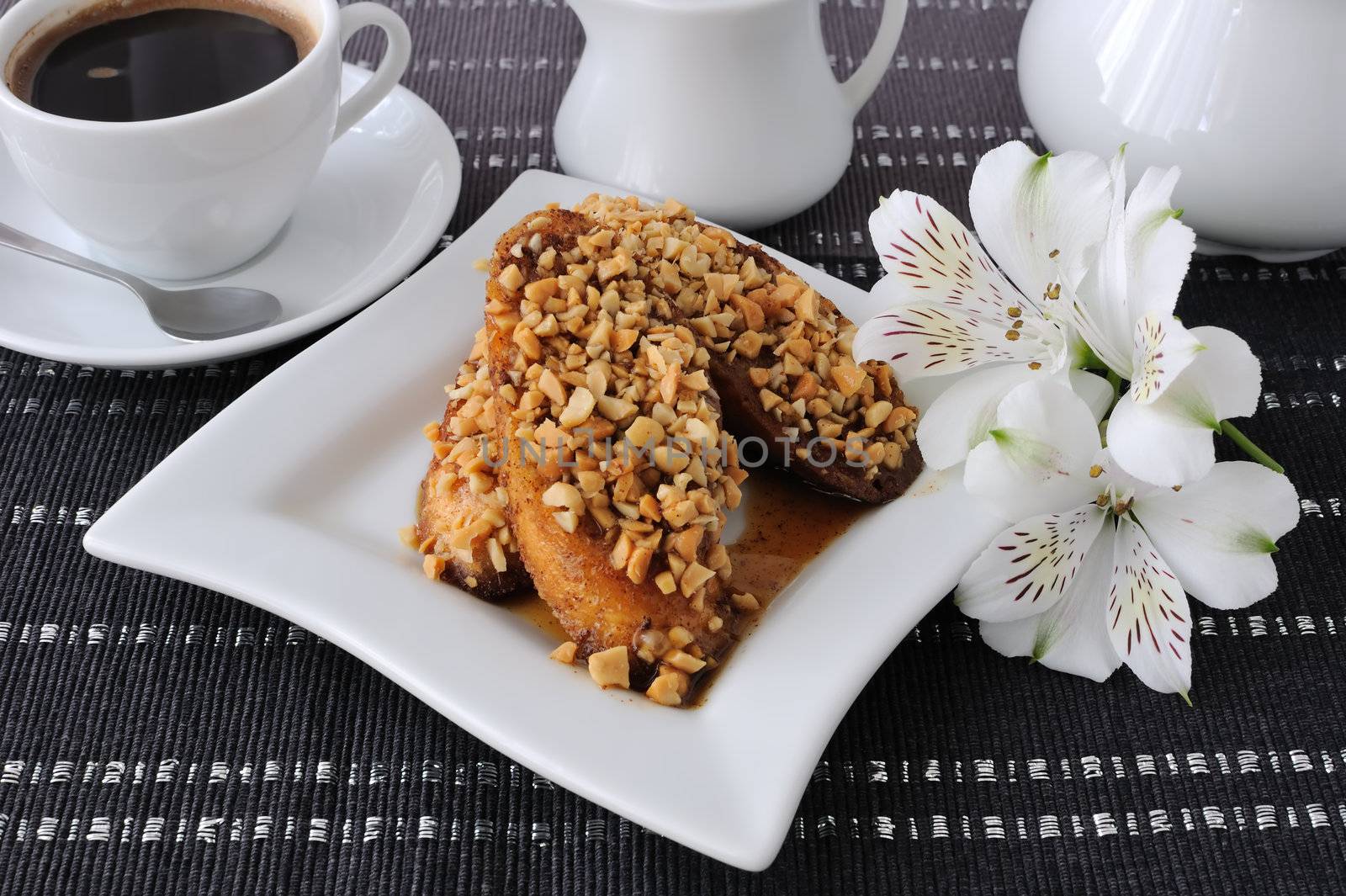 French toast with walnuts and cinnamon and a cup of coffee
