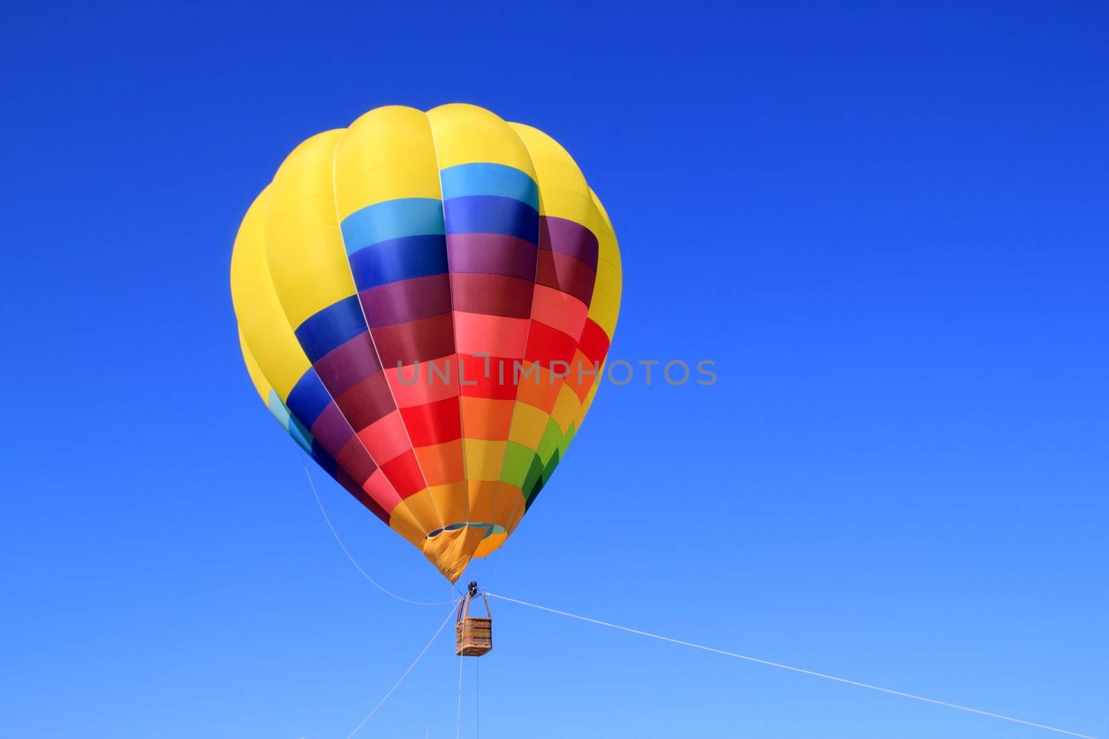 balloon colorful vivid colors in blue sky by lunamarina