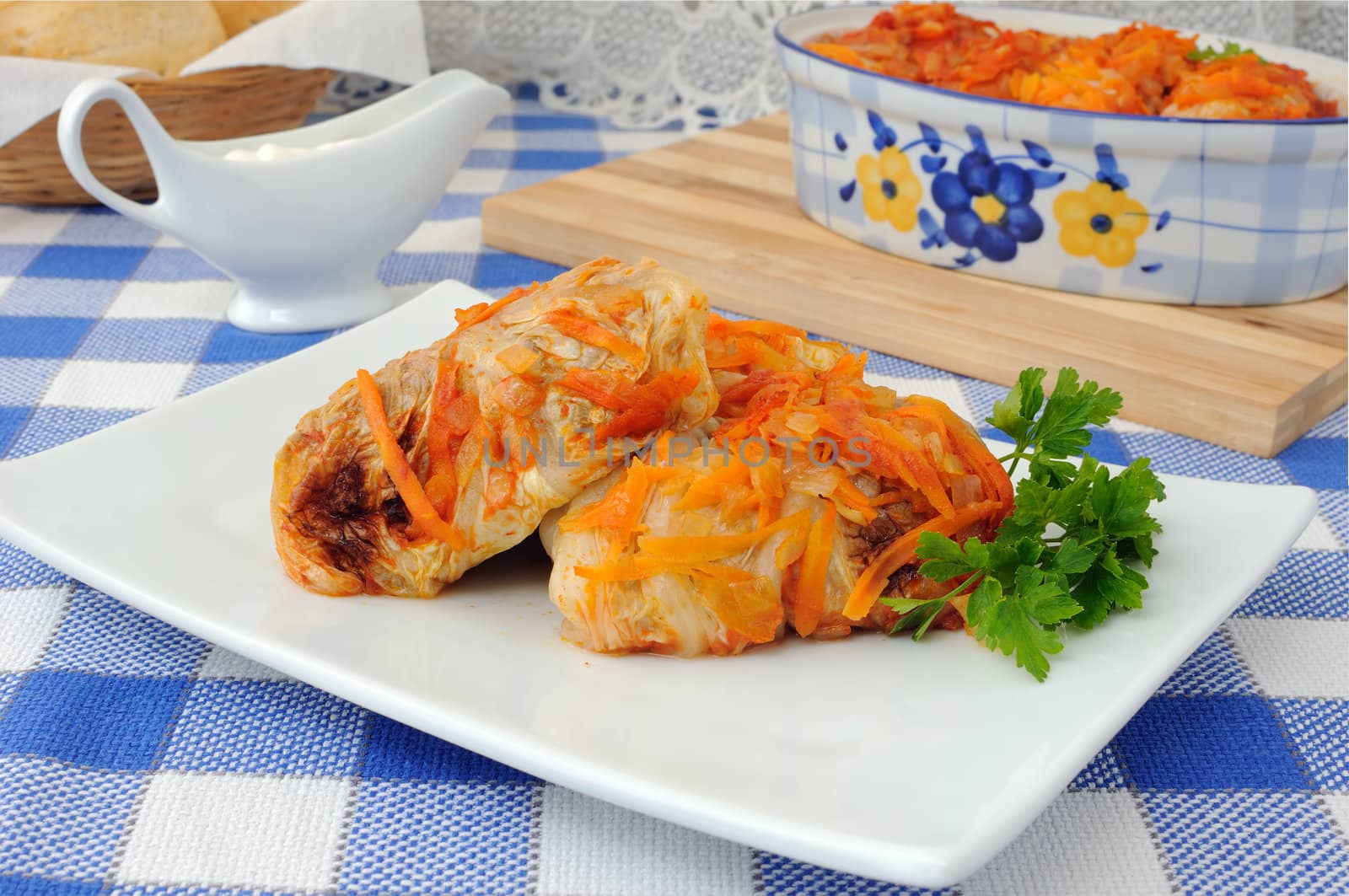 Stuffed cabbage stewed in tomato gravy with onions and carrots