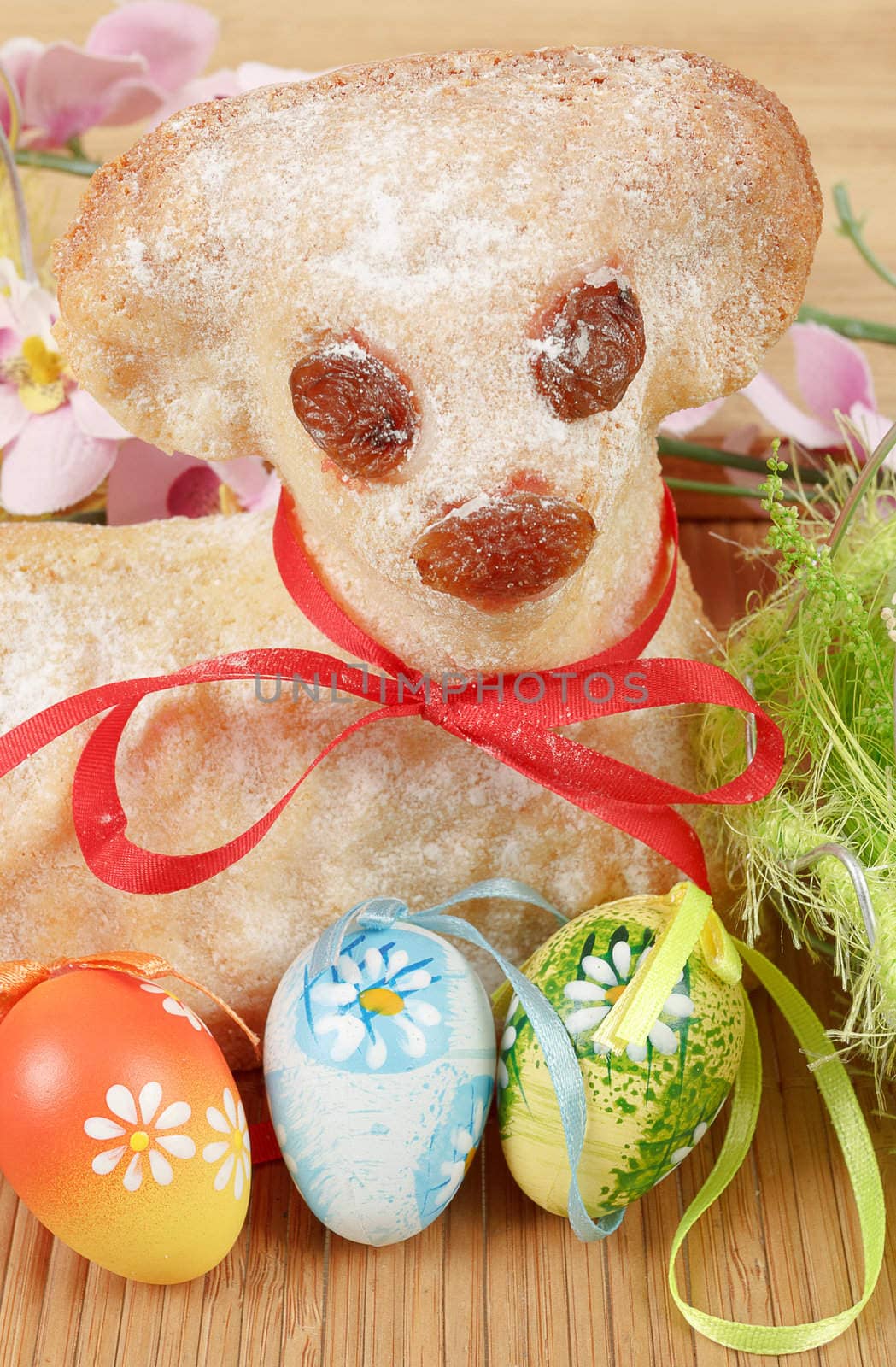 Easter lamb with painted eggs and easter decorations