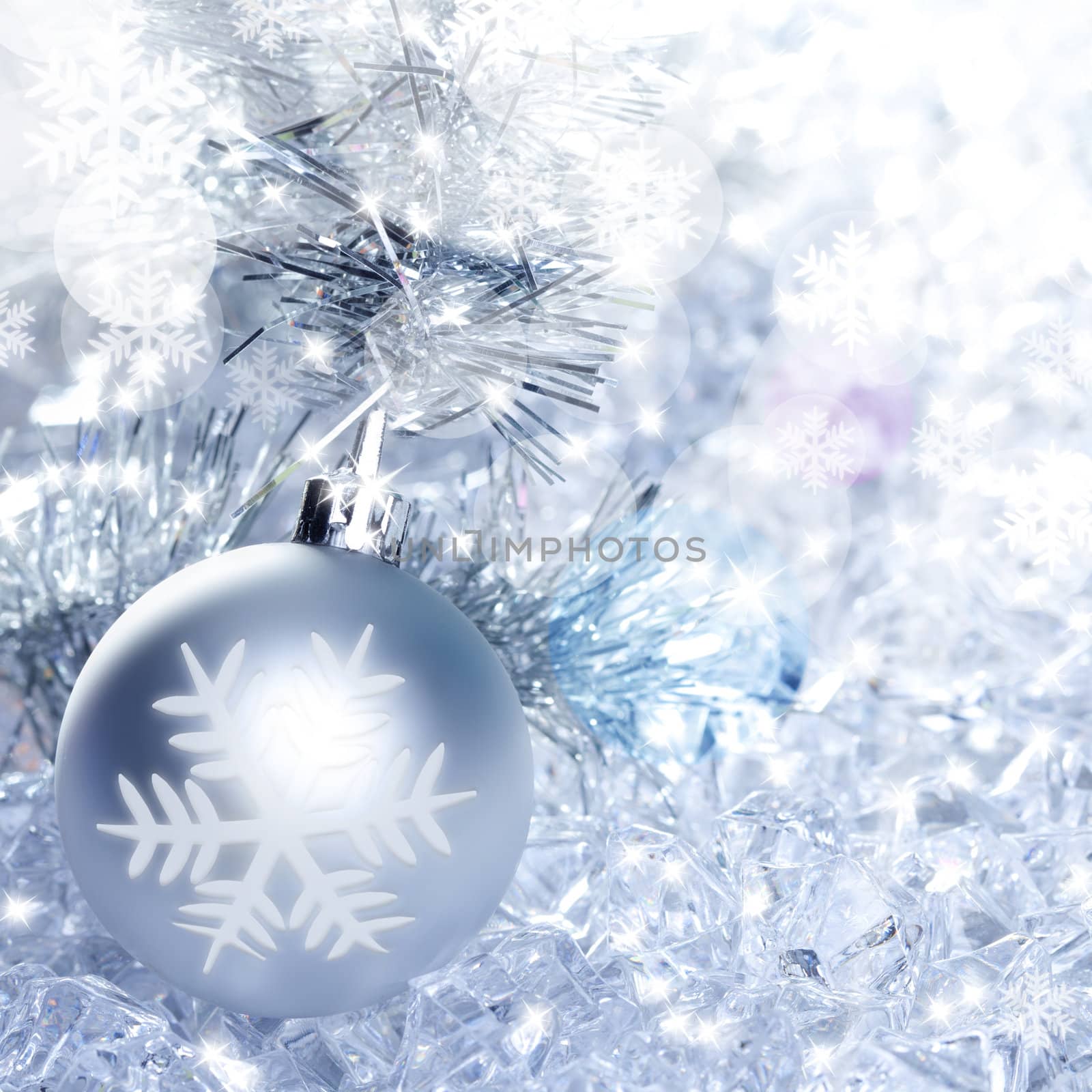 christmas baubles silver on winter ice with star symbol shapes