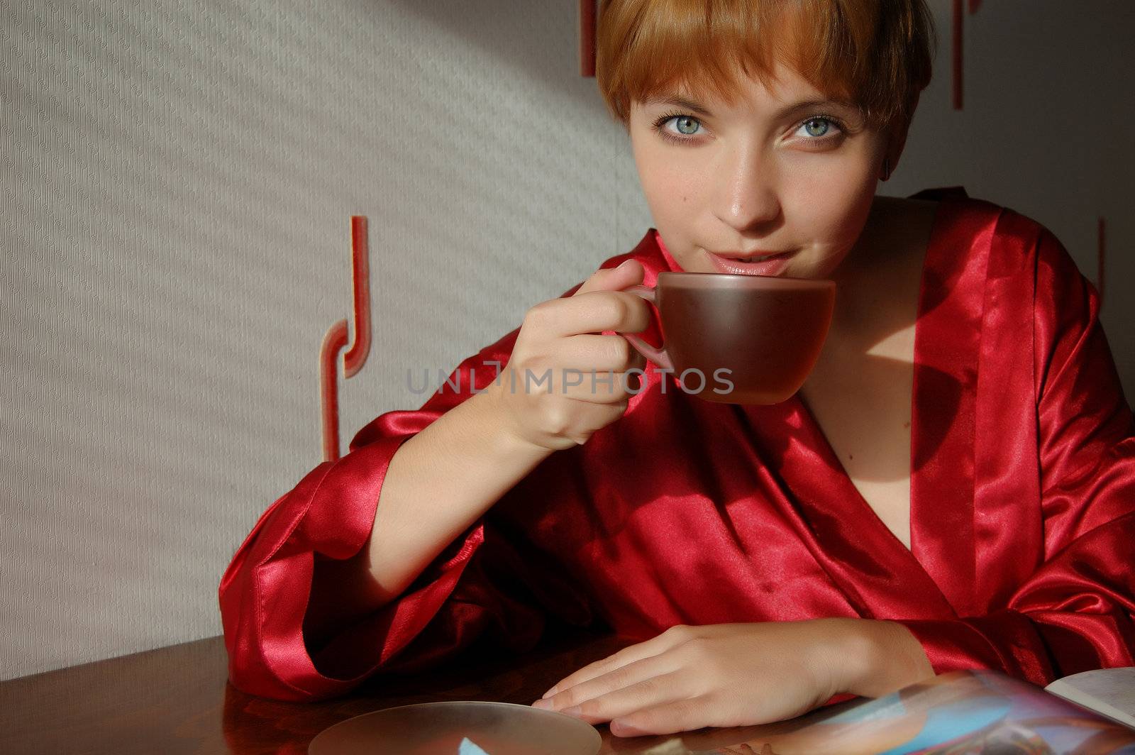 girl having breakfast with cup of tea