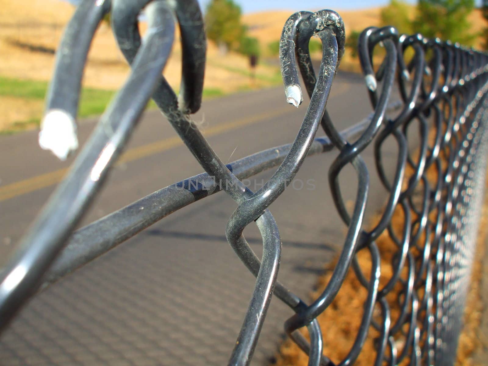 Close up of a chain link fence showing unique pattern.