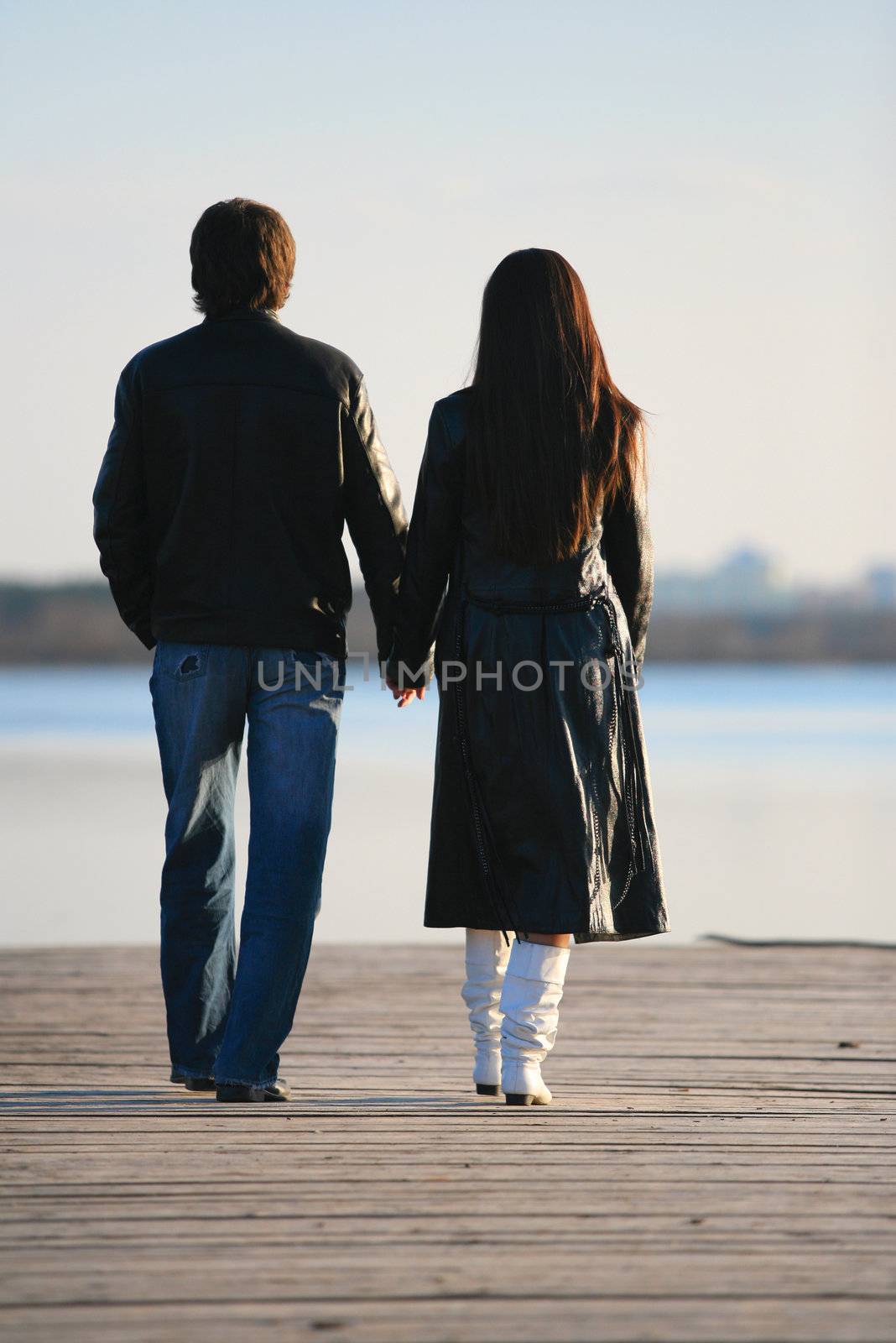 The in love pair walks on the bridge