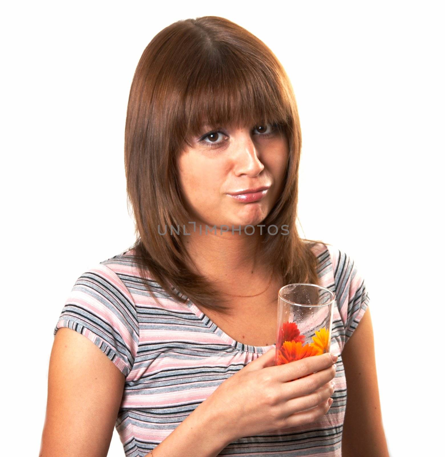 The girl drinking juice on a white background 