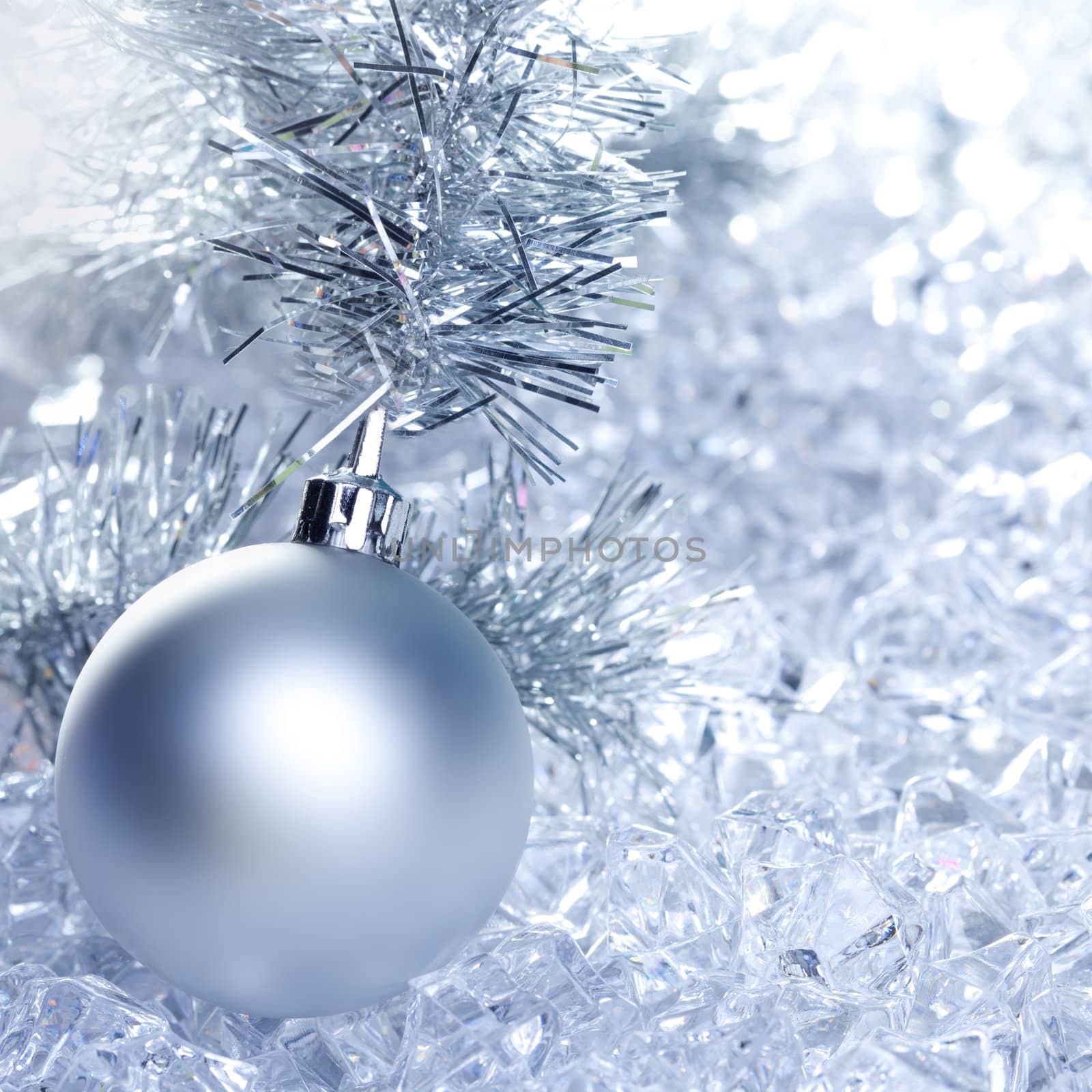 christmas baubles silver on winter ice with star symbol shapes