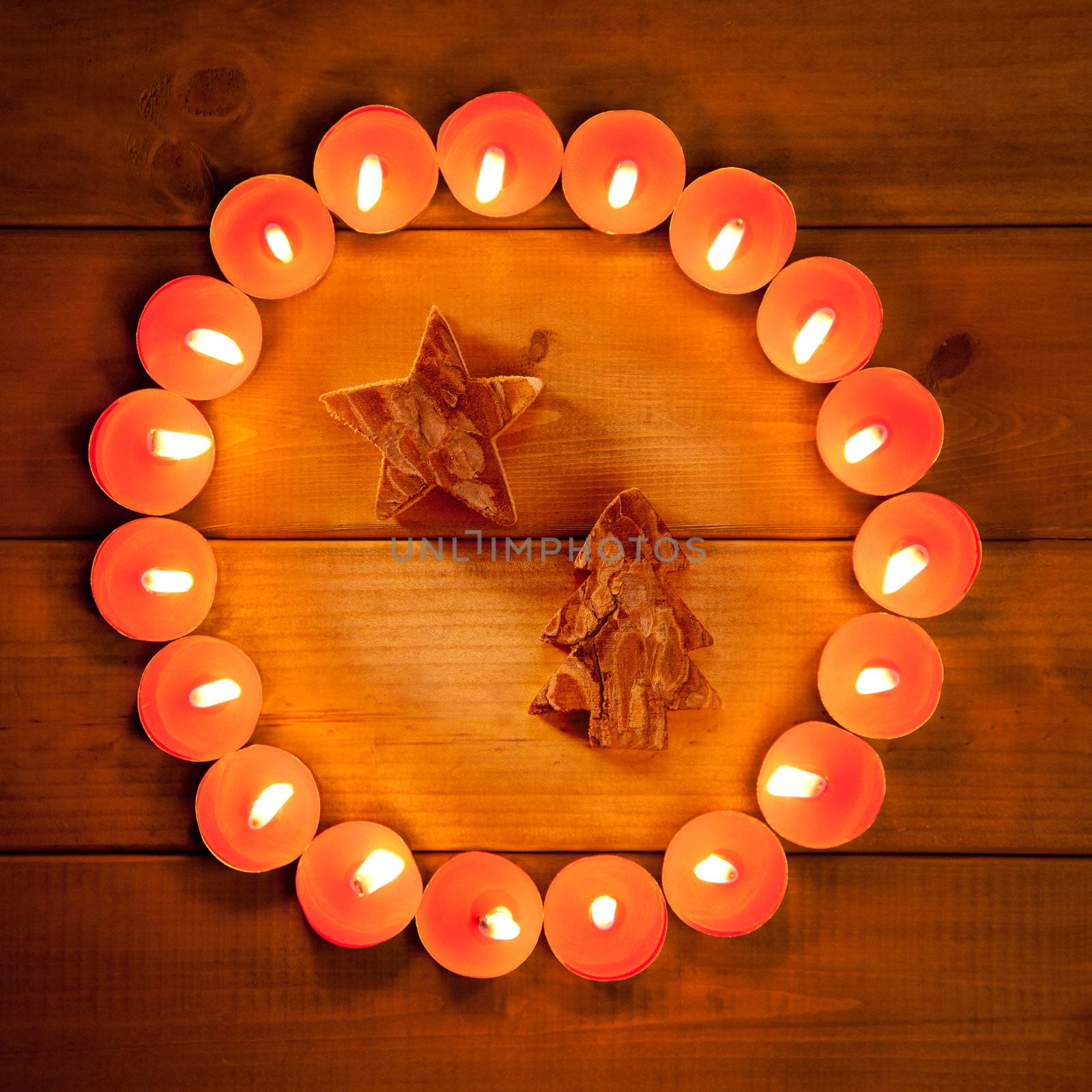christmas candles circle over wood and tree star symbol
