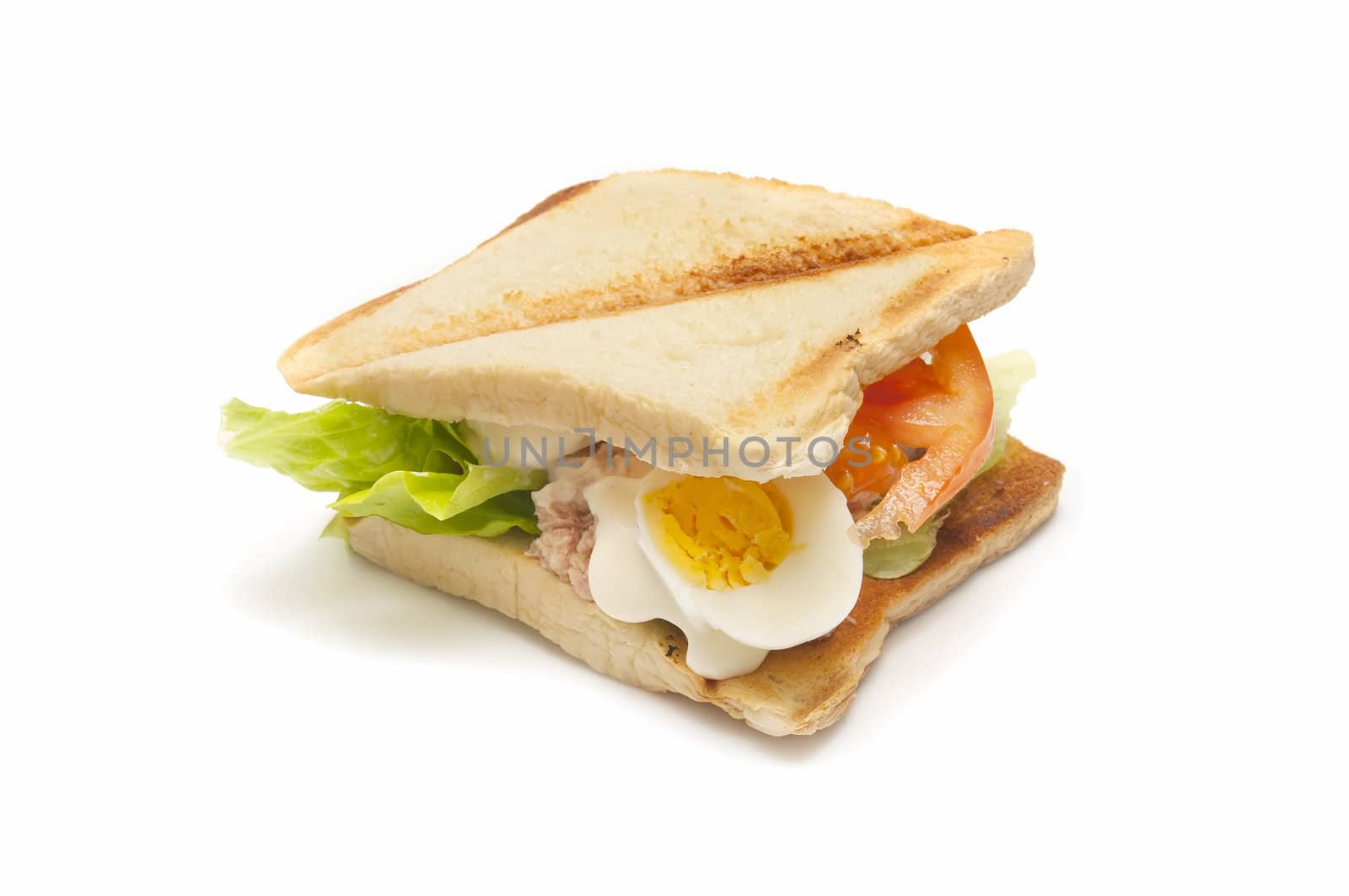 vegetable sandwich with tuna, tomato, lettuce and egg isolated on white background

 
