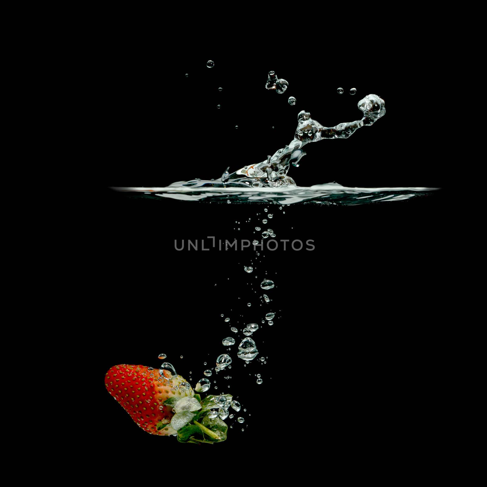 strawberry splashing in water by Discovod