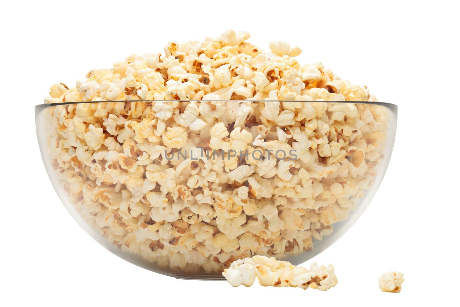 popcorn in glass bowl over white background