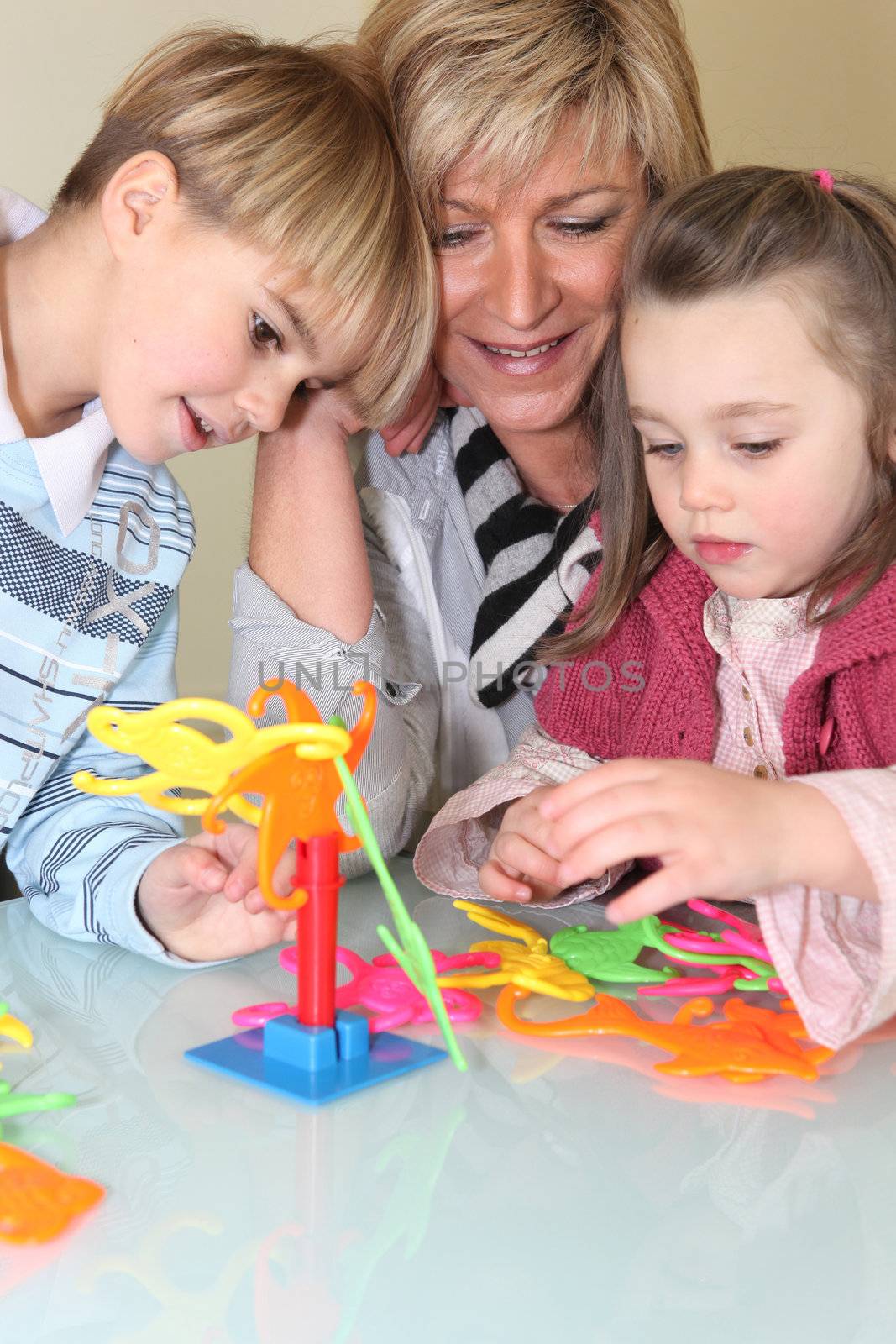 Mother and children playing a game