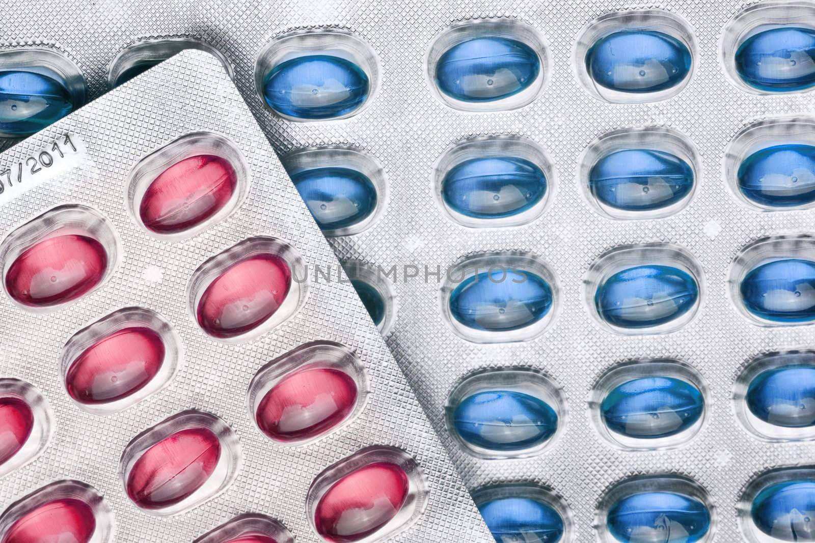 Red and Blue Pills On Metal Blister, copy space
