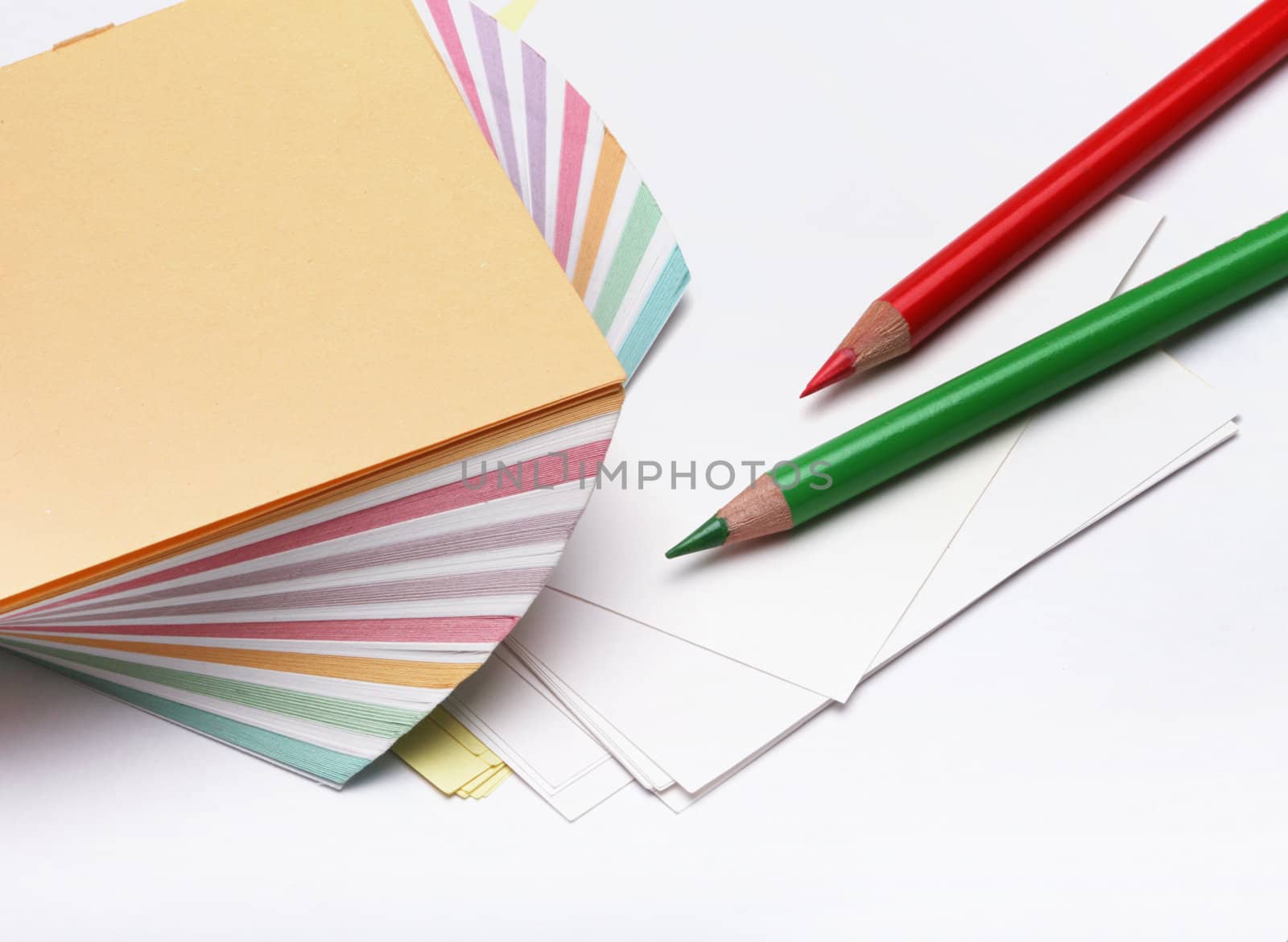 pencils and a stack of paper by rudchenko