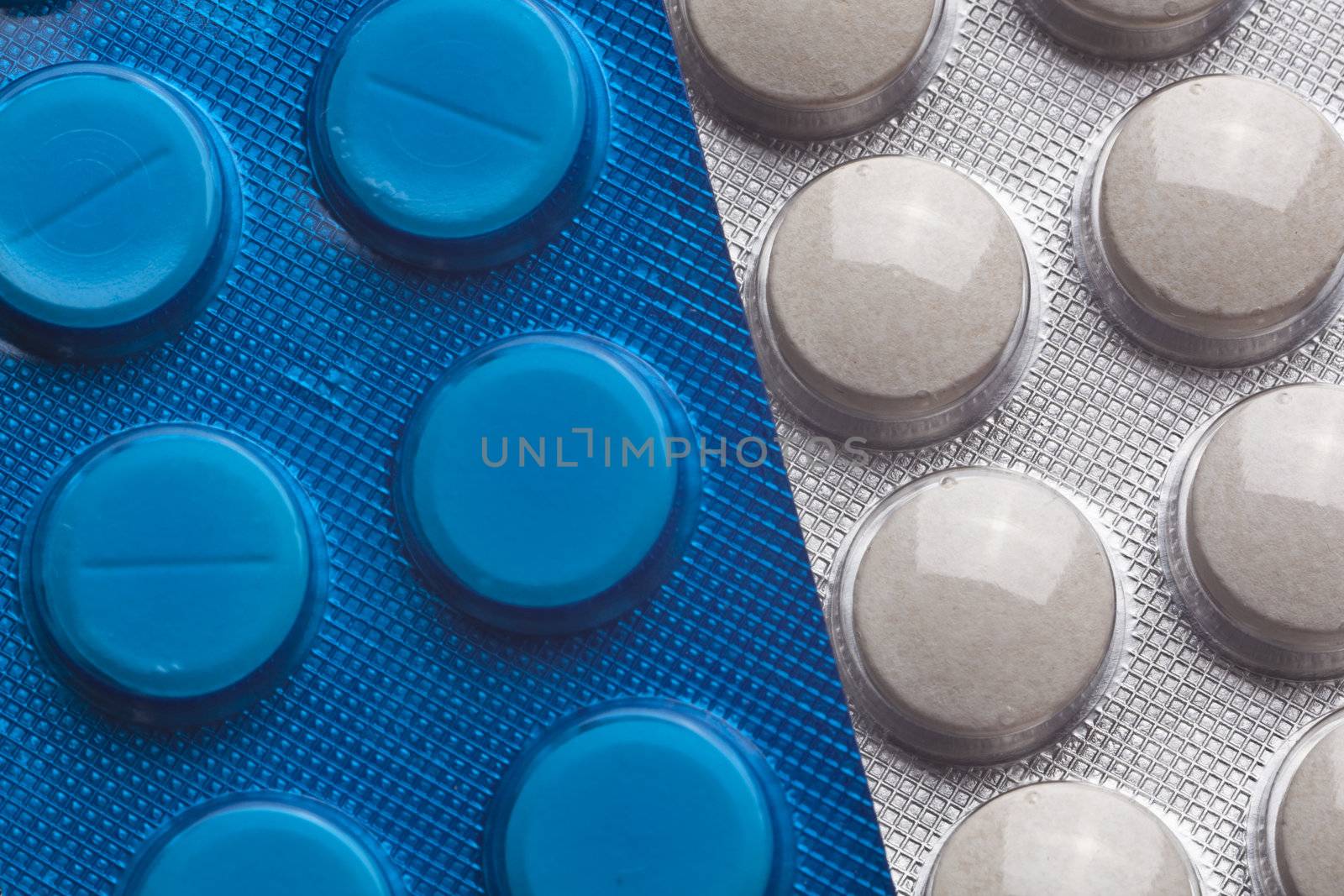 Blue and wihte Silver Pills On Metal Table Background, copy space