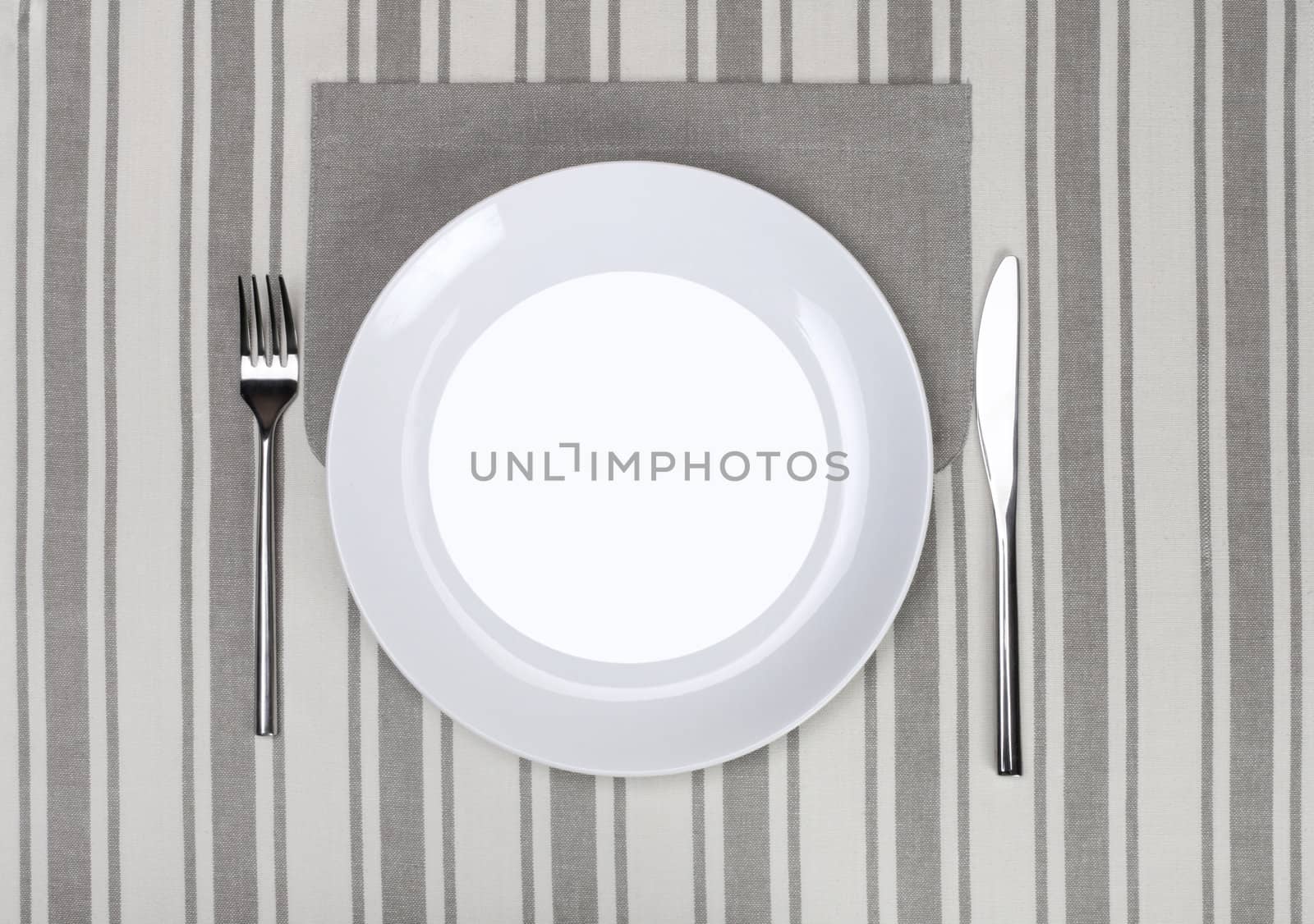 empty plate with fork and knife