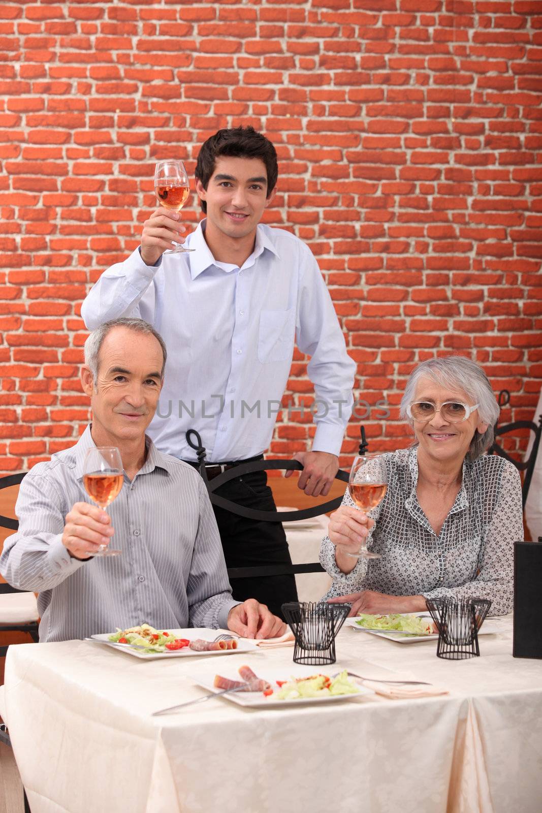 portrait of a family toasting by phovoir
