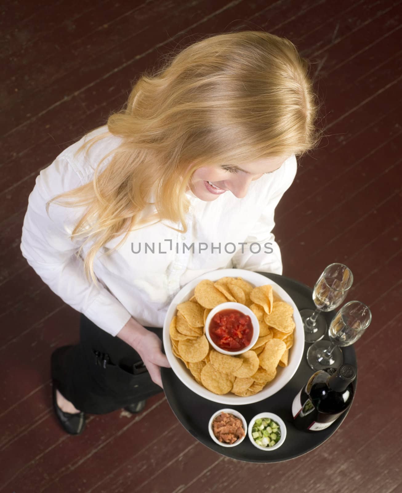 Young Attractive Female Server Brings Wine and Appetizer Food Tr by ChrisBoswell