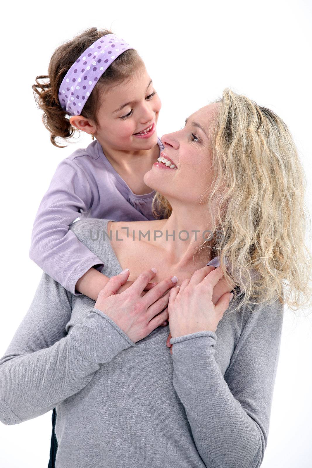 portrait of happy young mother and daughter by phovoir