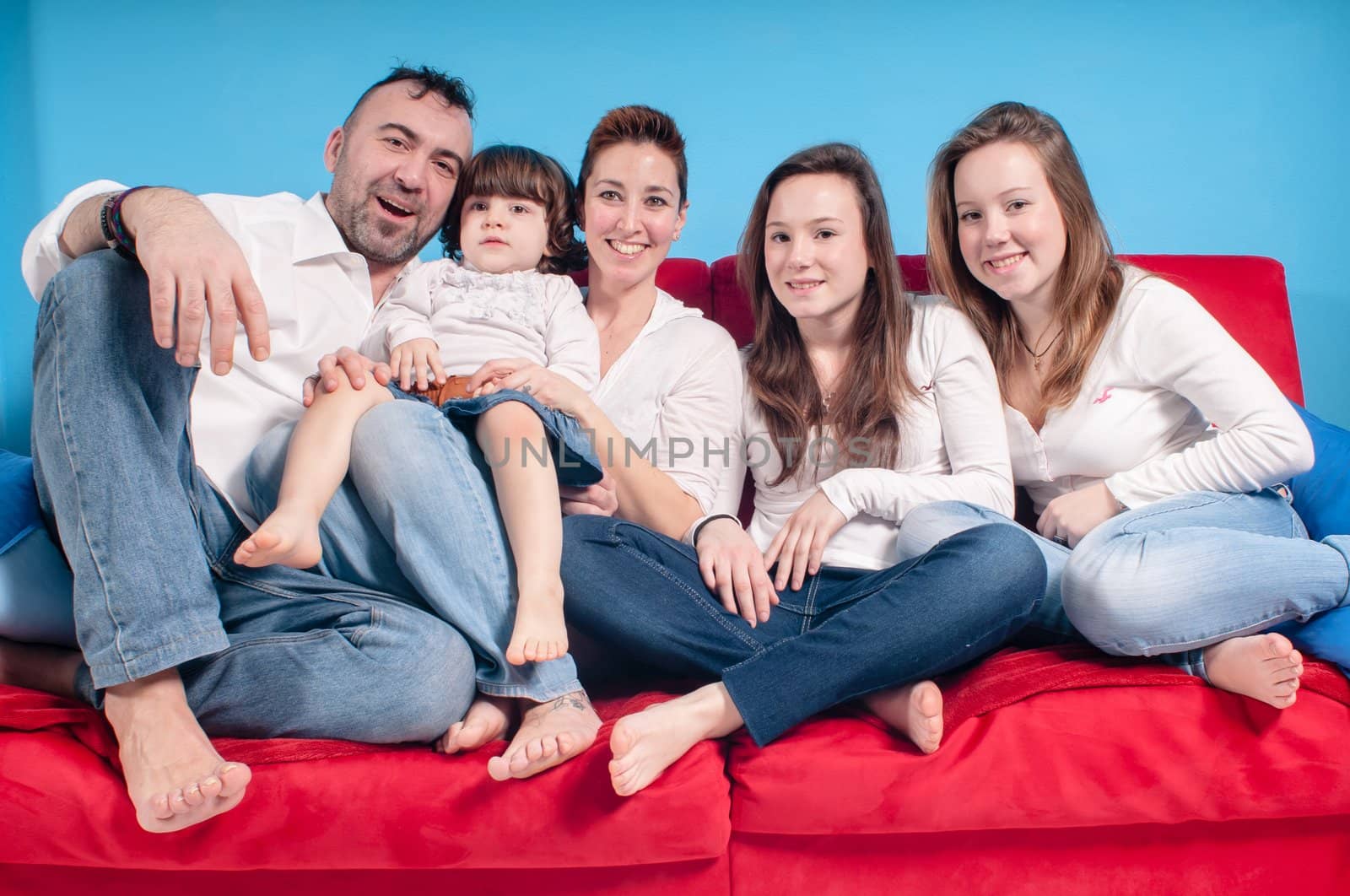 happy family on the couch by peus