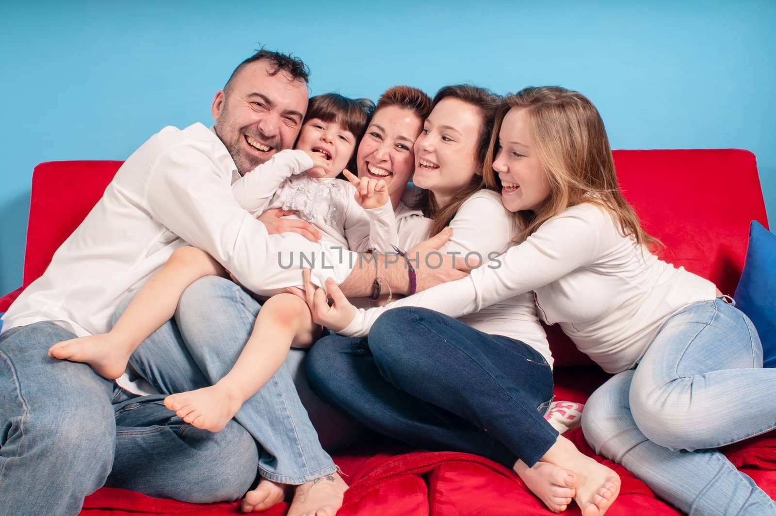 happy family on the couch by peus