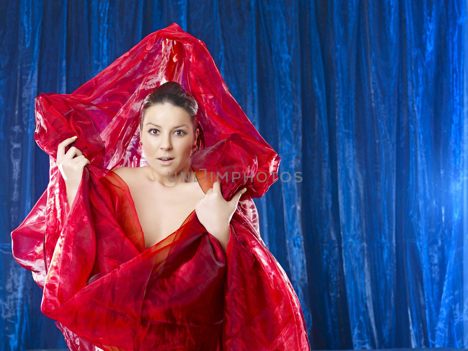 Amazing 40 mega pixel - Mystic and beautiful lady in red silk on blue background