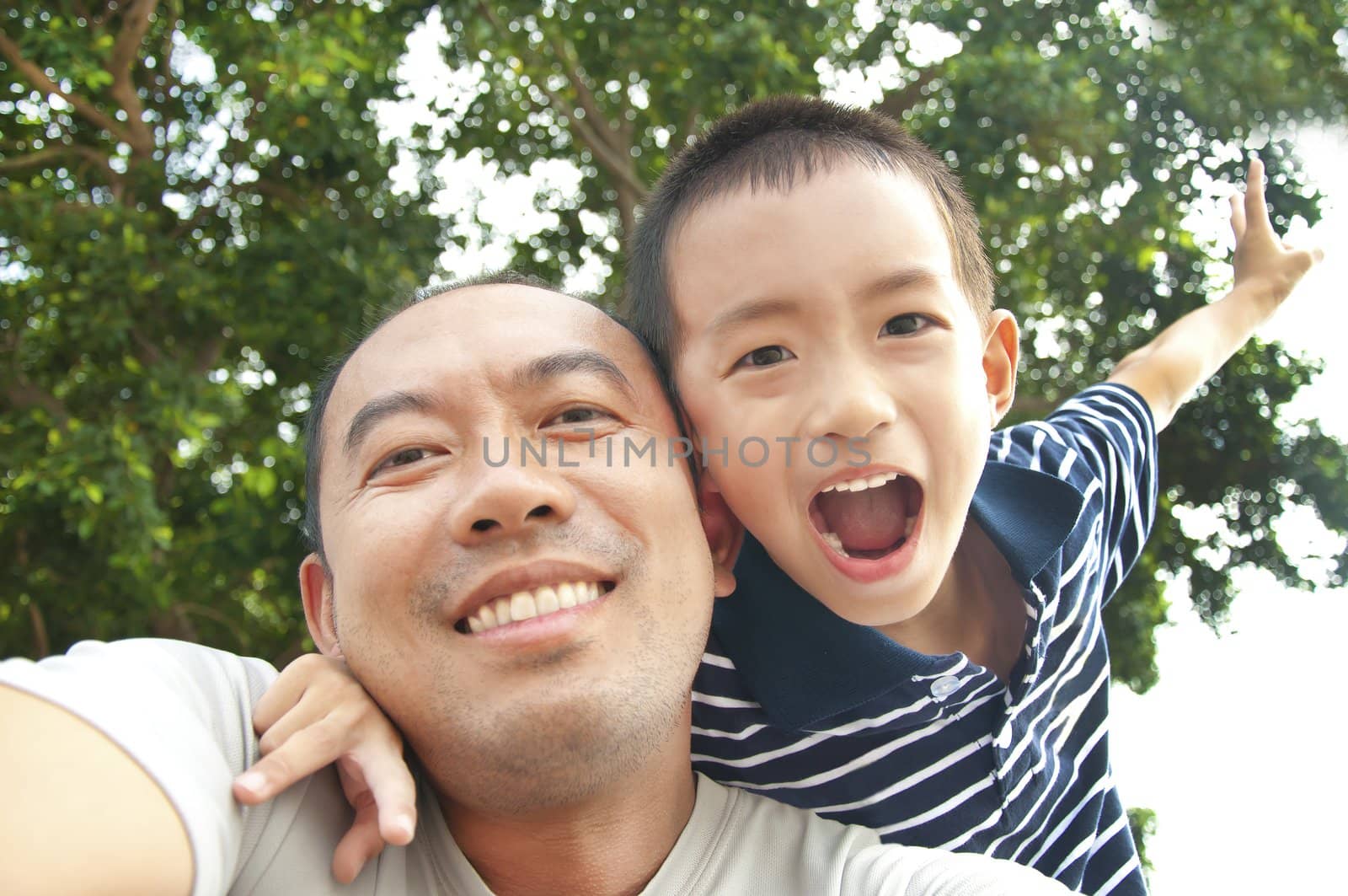 Happy father and son in the park