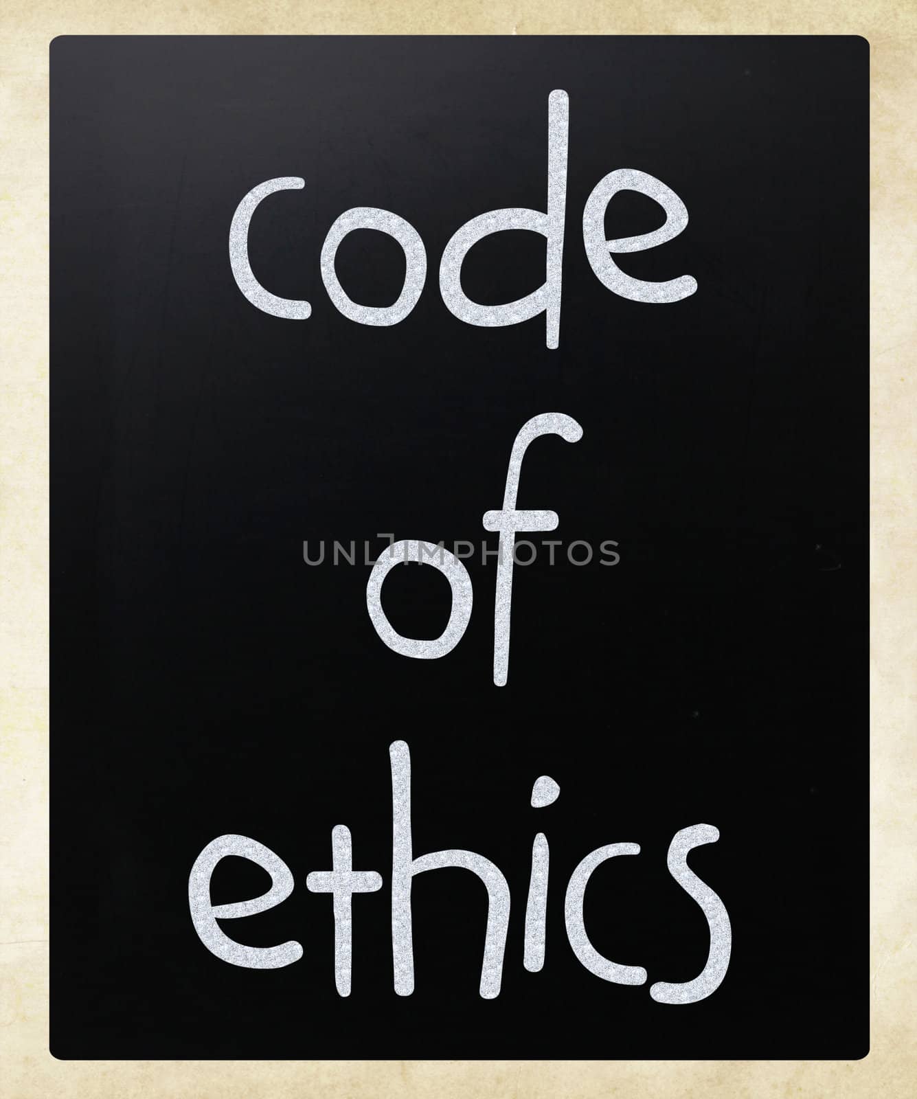 "Code of ethics" handwritten with white chalk on a blackboard