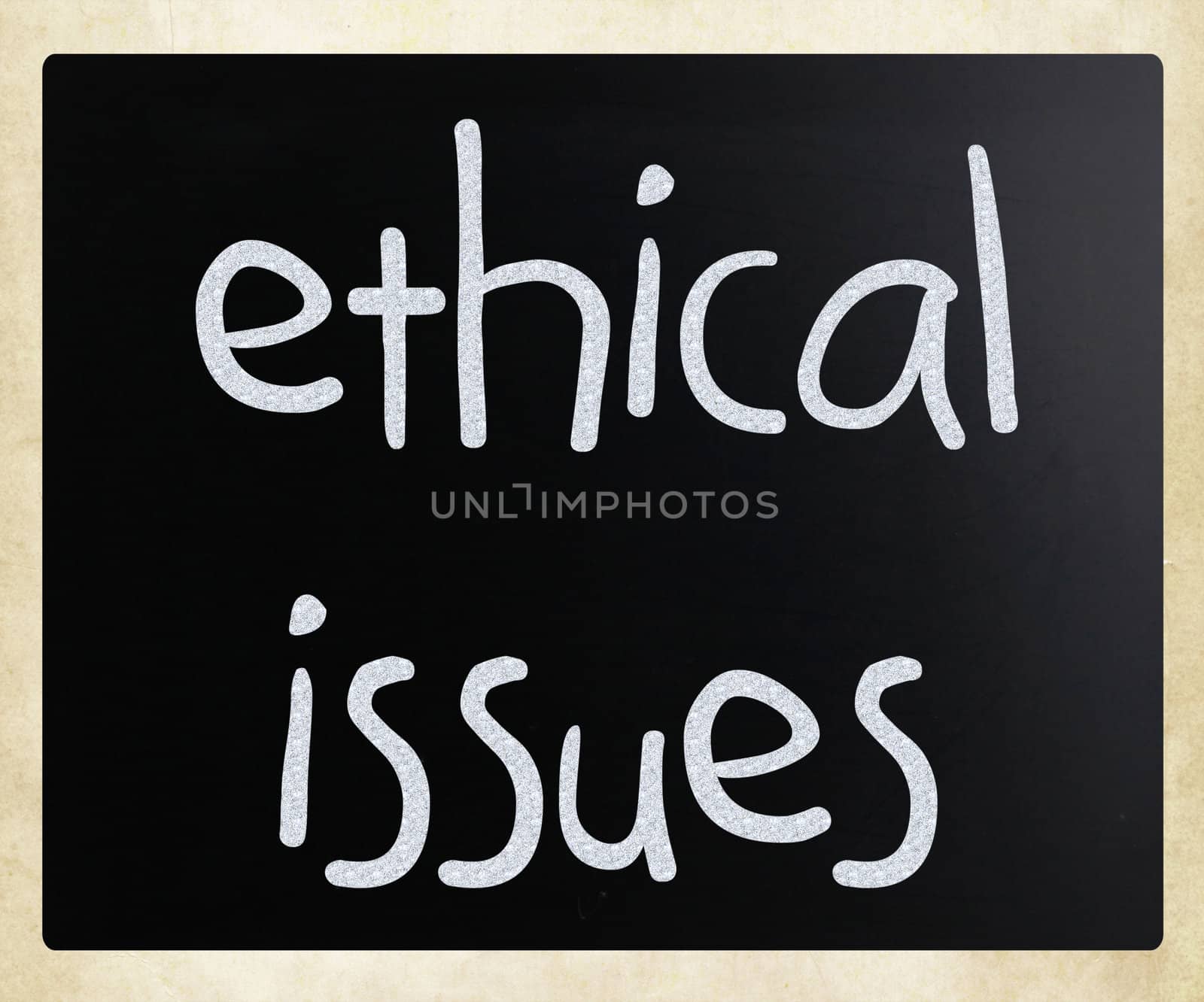 "Ethical issues" handwritten with white chalk on a blackboard