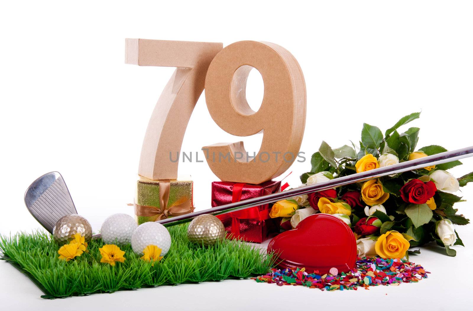 Roses, a golf club and golf balls on an artificial peace of grass to be used as a birthday card