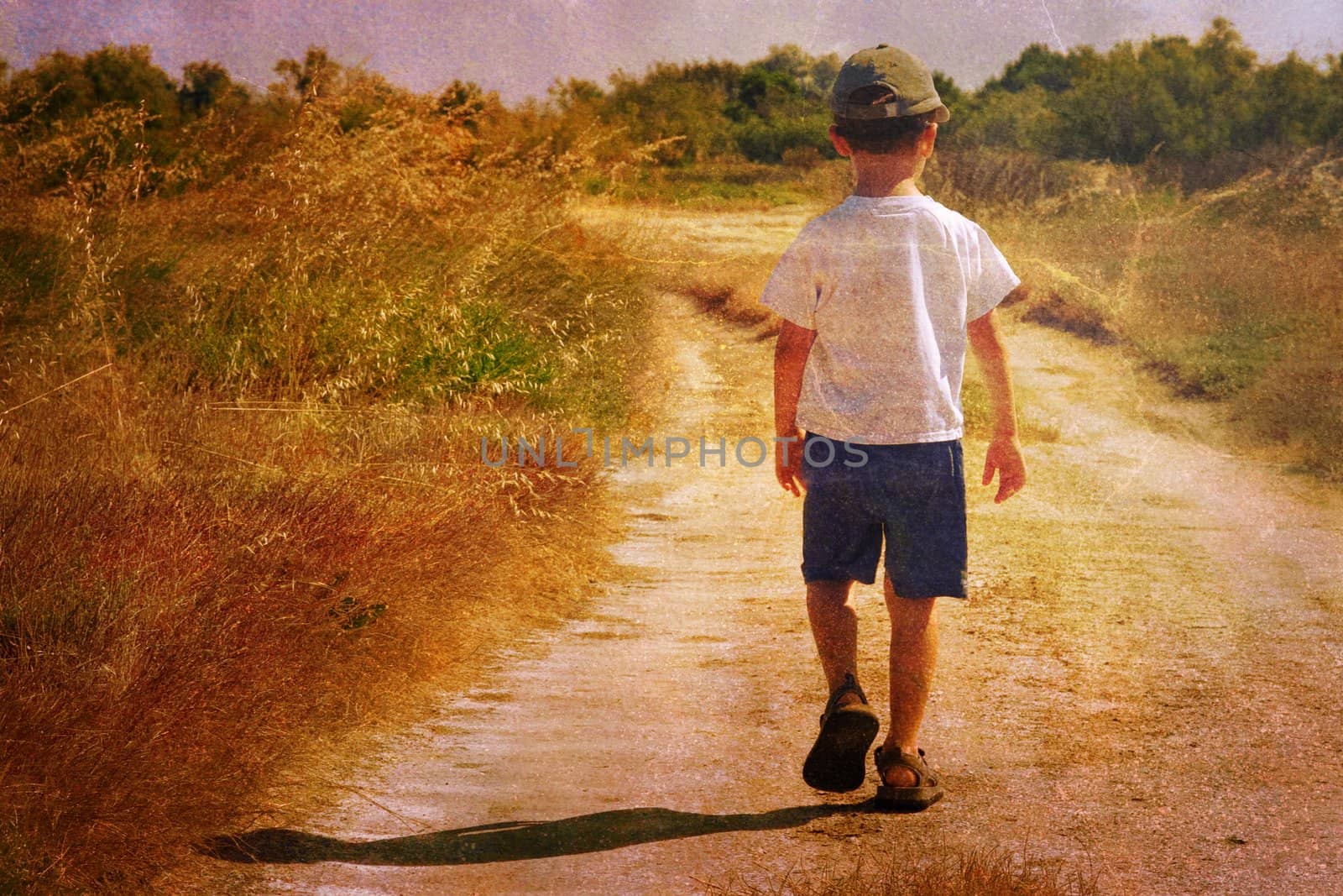 Vintage picture of a young child walking on a road