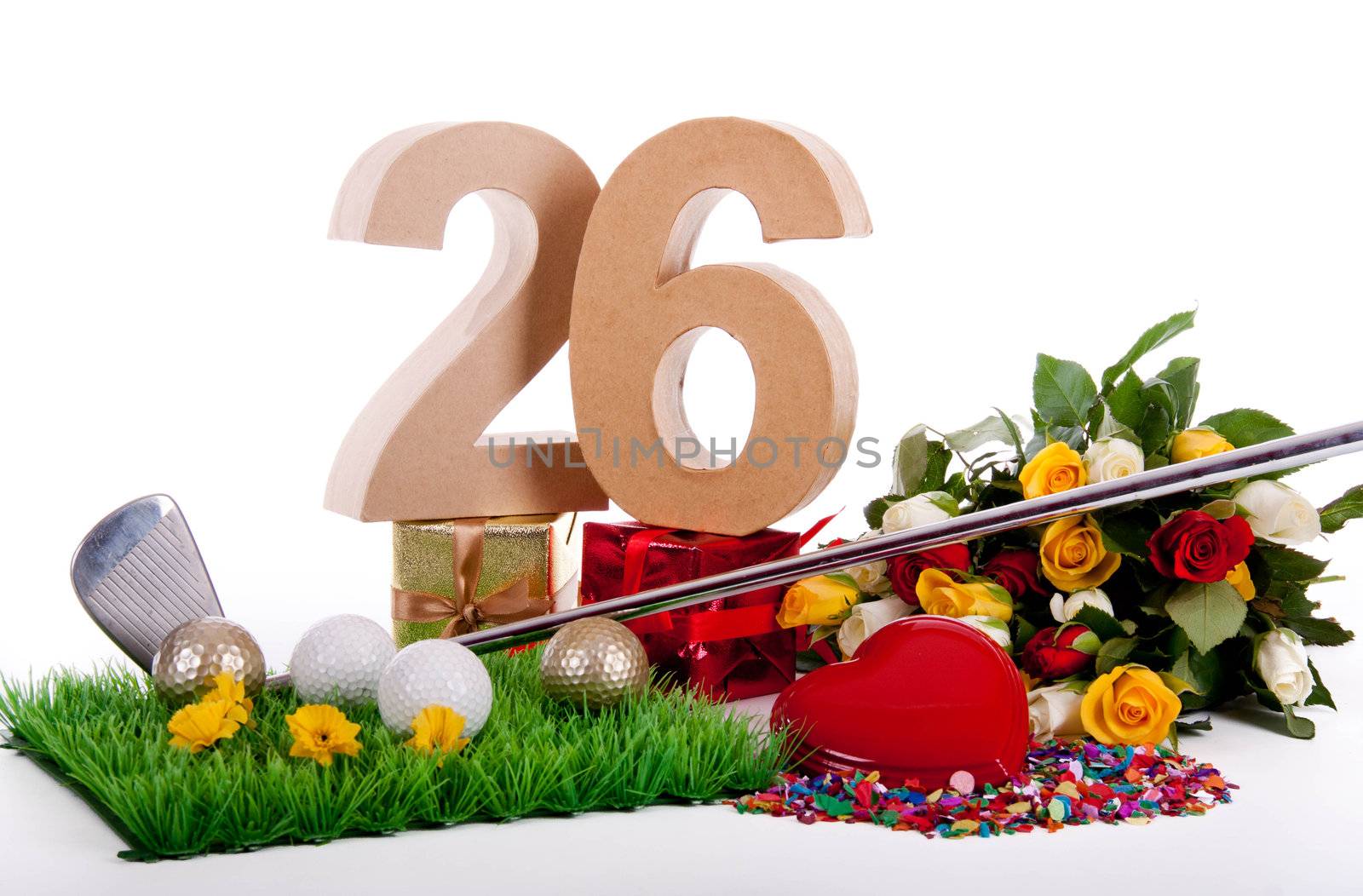 Roses, a golf club and golf balls on an artificial peace of grass to be used as a birthday card