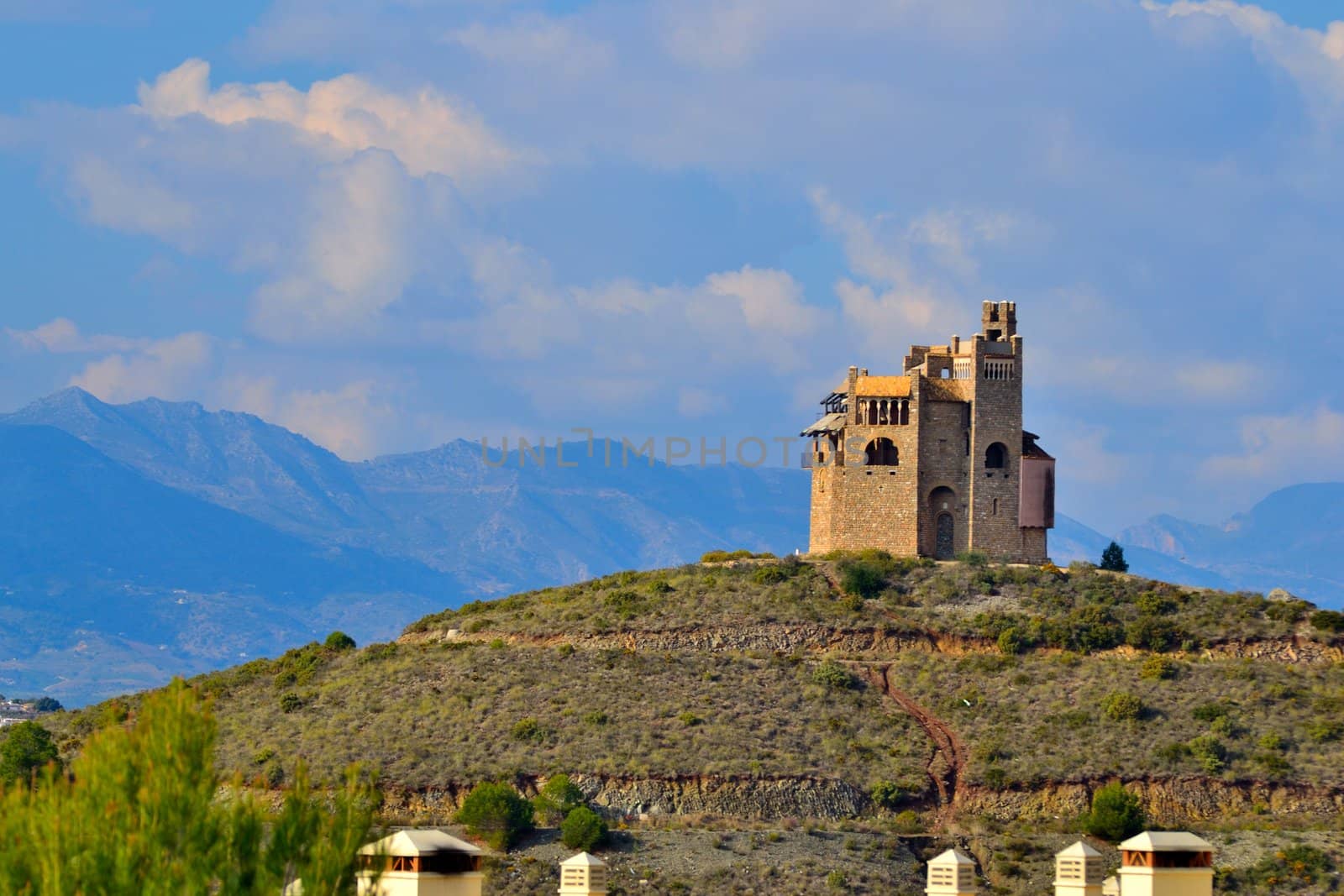 castle located in the mountains, edging mijas