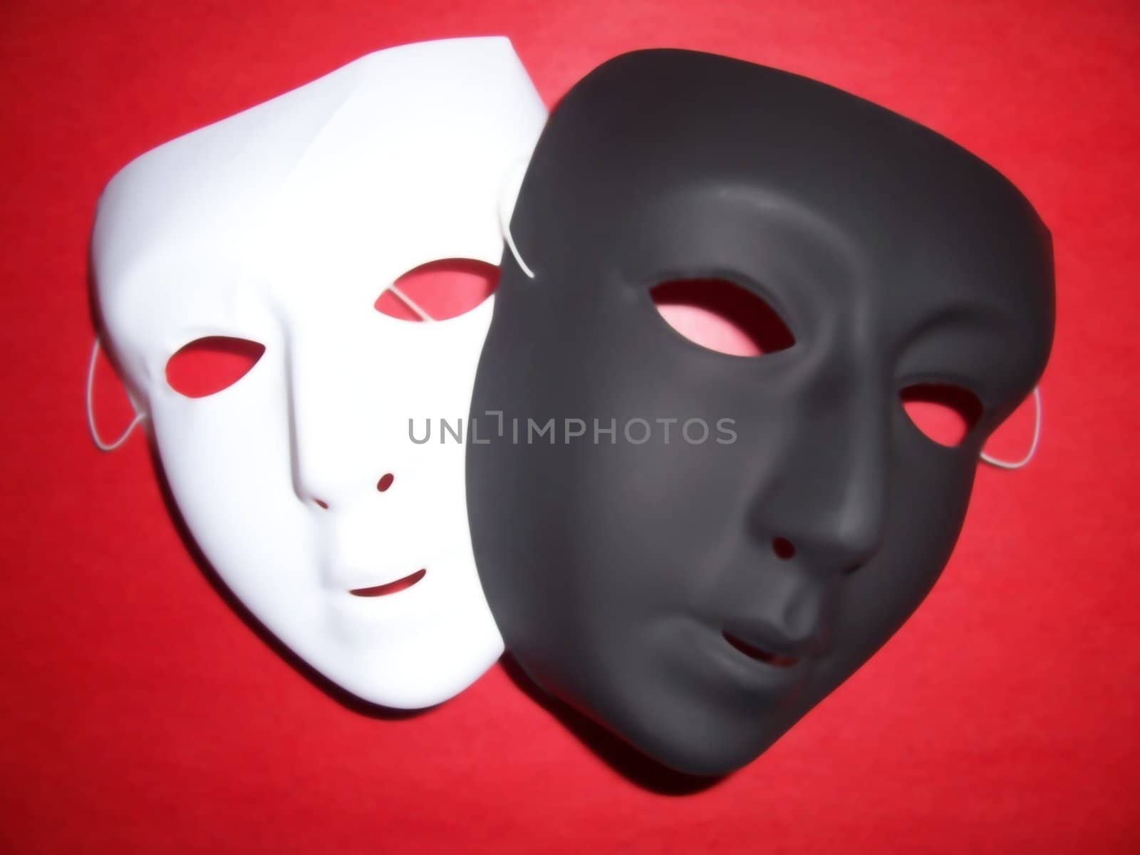 Isolated black and white masks on a red background