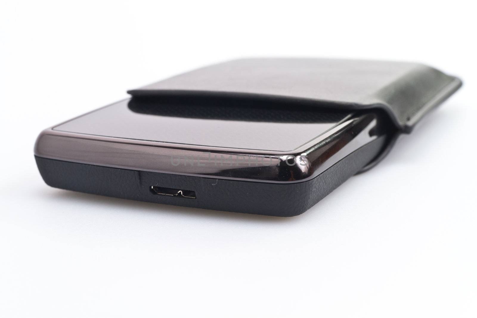close up view of a portable harddisk with soft leather case on white background
