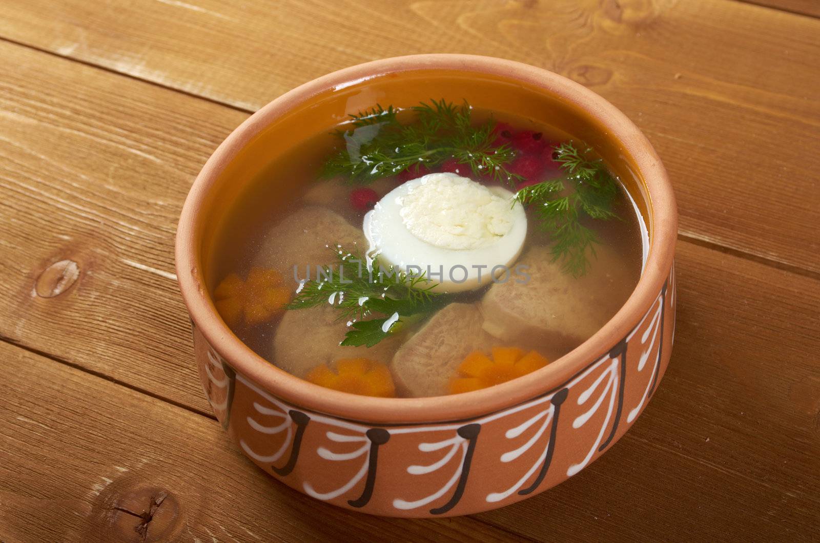Aspic from meat decorated with egg, carrot,