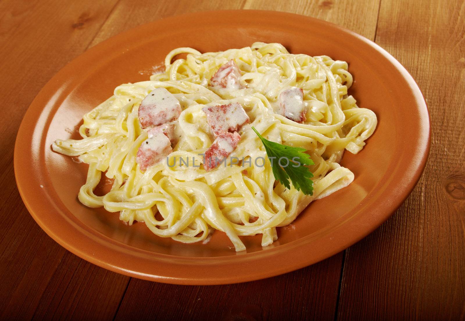 pasta Fettuccine Alfredo with sausage. close-up