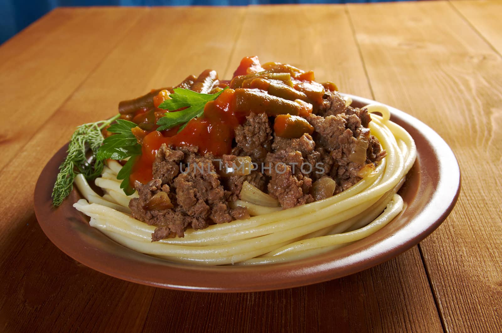  pasta with  beef ,vegetable  tomato sauce  on wooden table