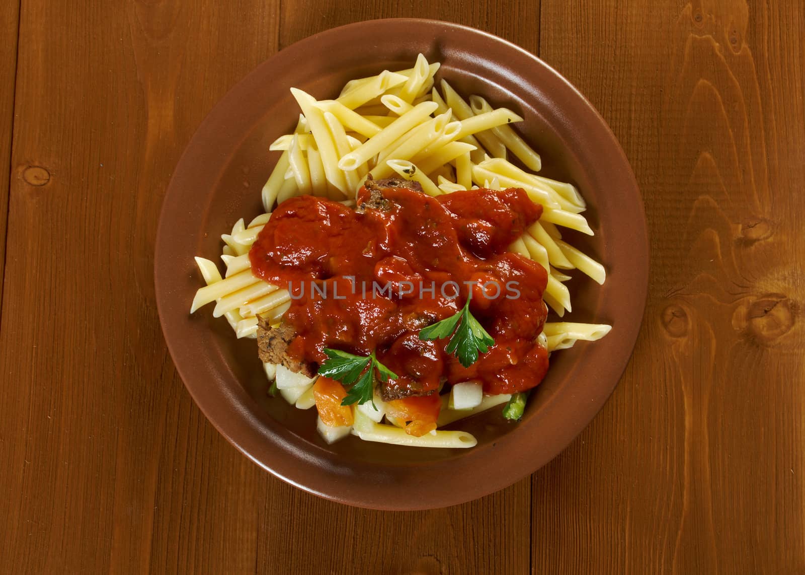  pasta with tomato beef sauce  on wooden table