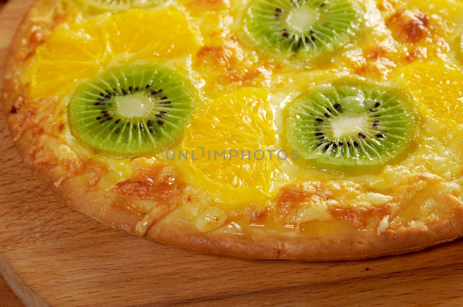 homemade sweet pizza with fruit.with orang kiwi,sauce