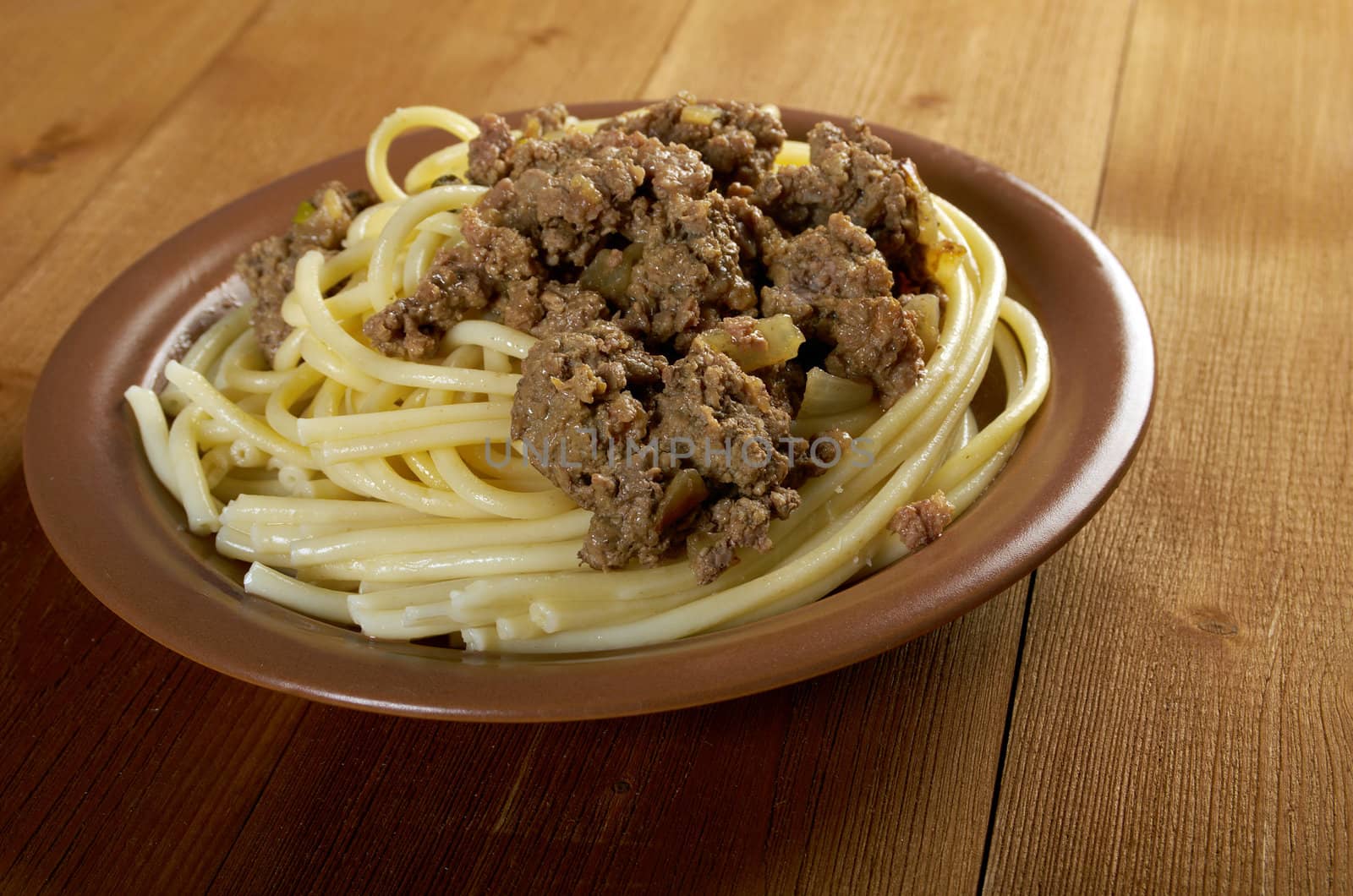  pasta with  beef on wooden table