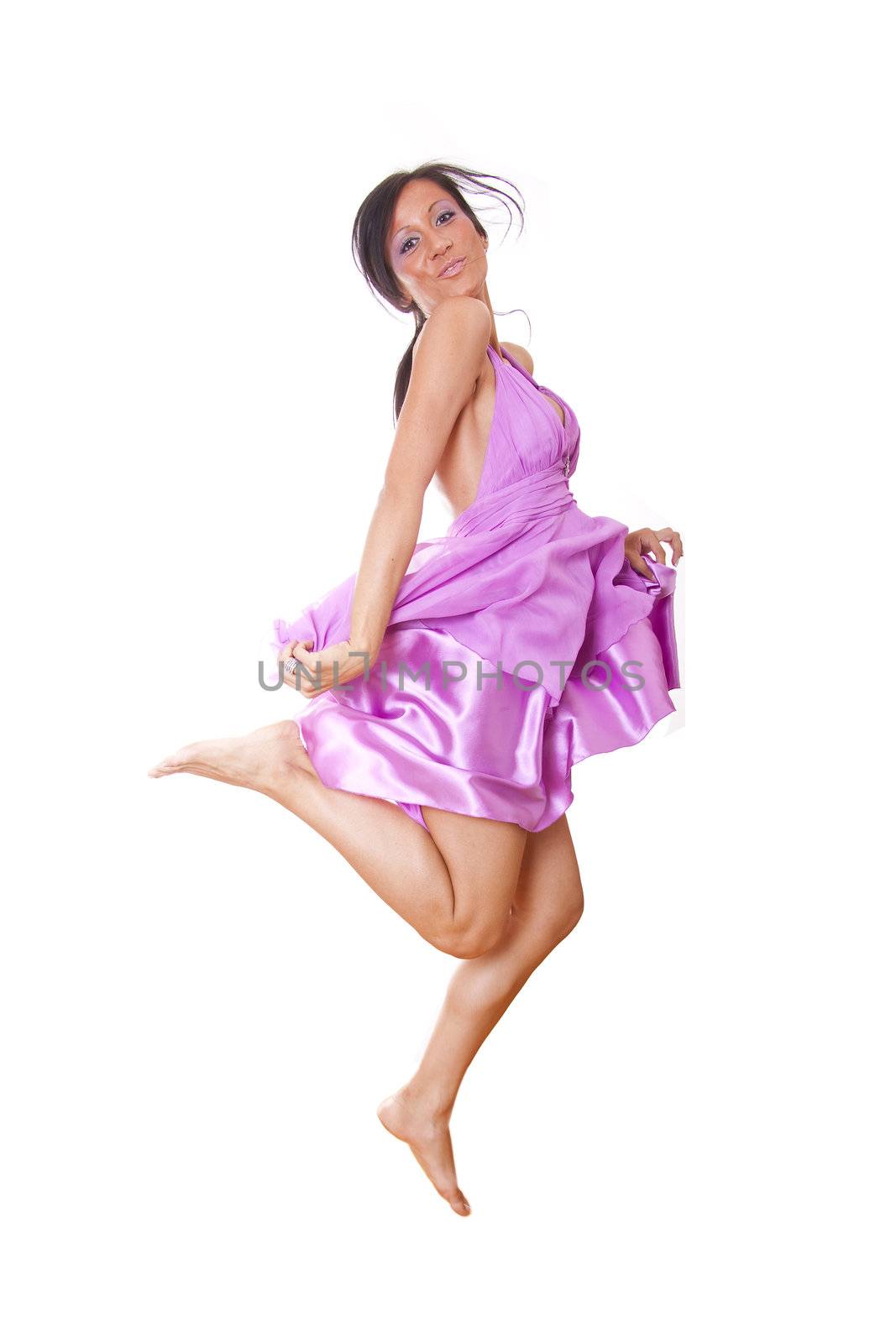 Woman In Violet Silk Dress Jumping, isolated on white