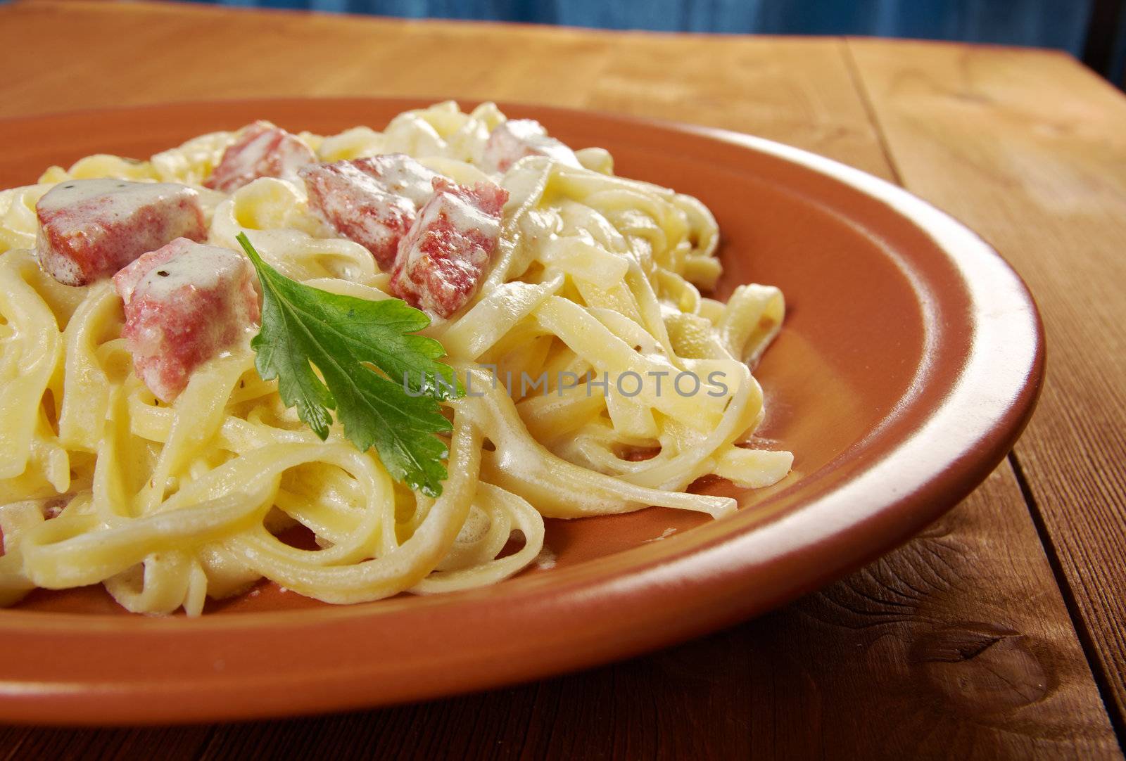 pasta Fettuccine Alfredo with sausage. close-up