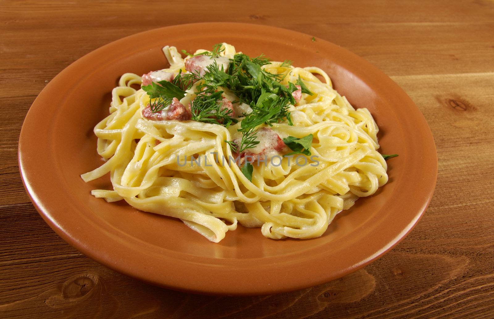 pasta Fettuccine Alfredo with sausage. close-up