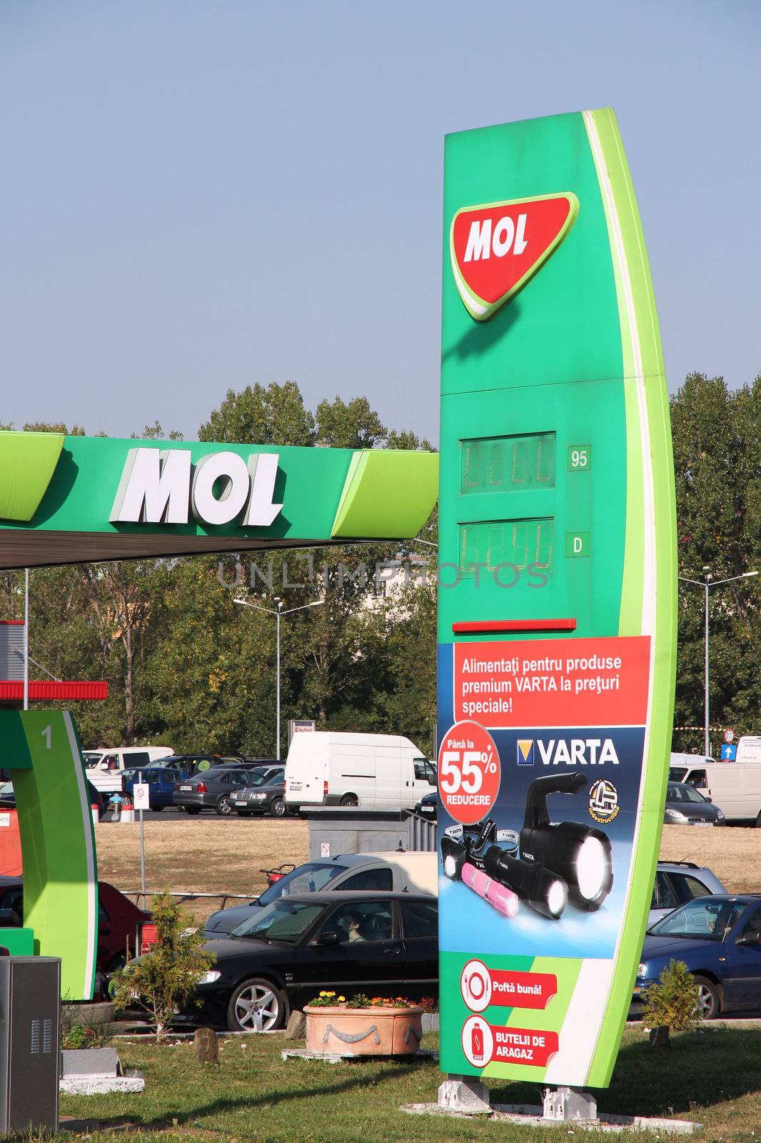 SIBIU, ROMANIA - AUGUST 24: Drivers fill up their tanks on MOL station on August 24, 2012 in Sibiu, Romania. MOL employs 31,732 people (2011) and has 1,635 filling stations (2011) internationally.