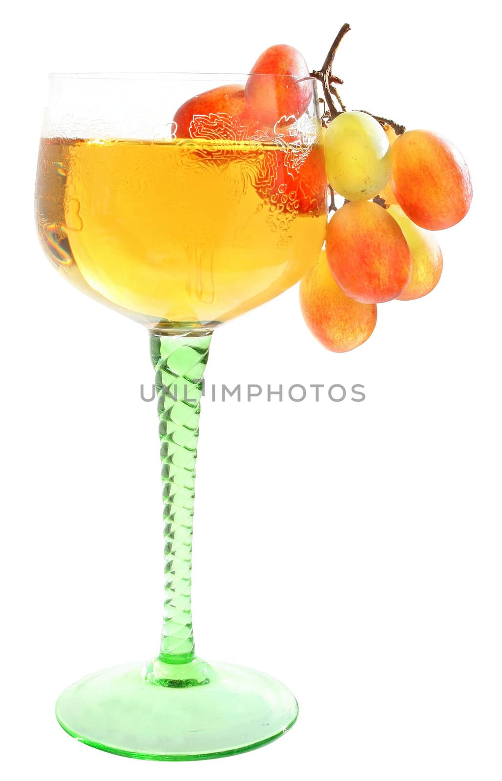 Wineglass with a drink and a grapes.