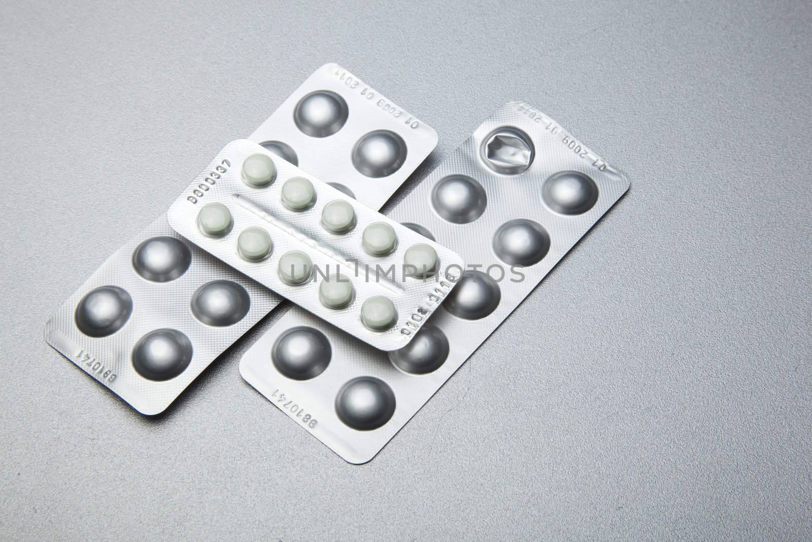 Silver Pills On Metal Table Background, copy space