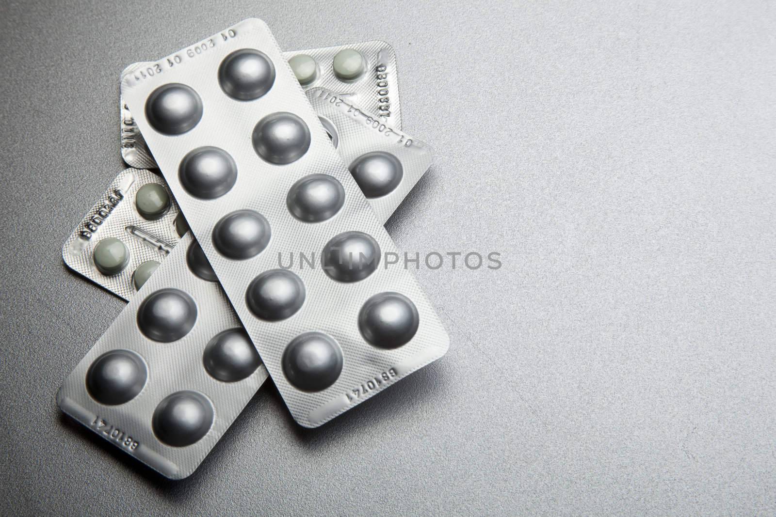 Silver Pills On Metal Table Background, copy space