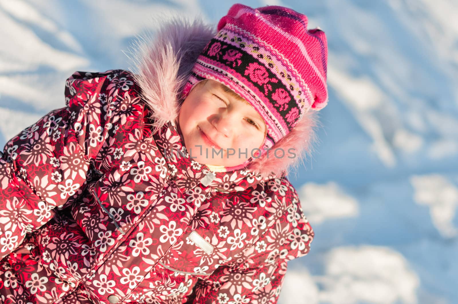 Baby sits on snow portrait by dmitryelagin