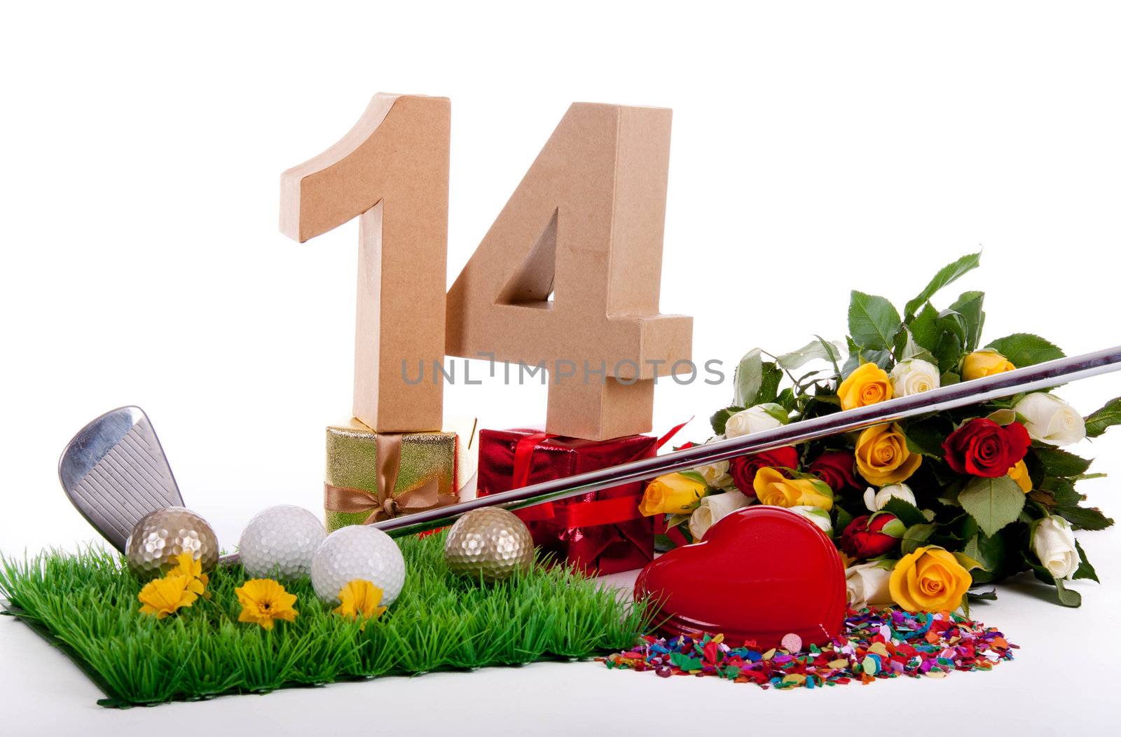 Roses, a golf club and golf balls on an artificial peace of grass to be used as a birthday card
