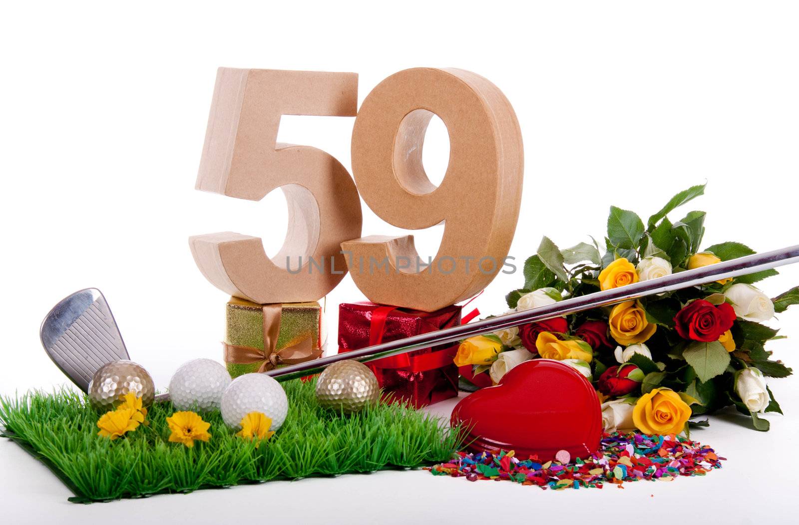 Roses, a golf club and golf balls on an artificial peace of grass to be used as a birthday card